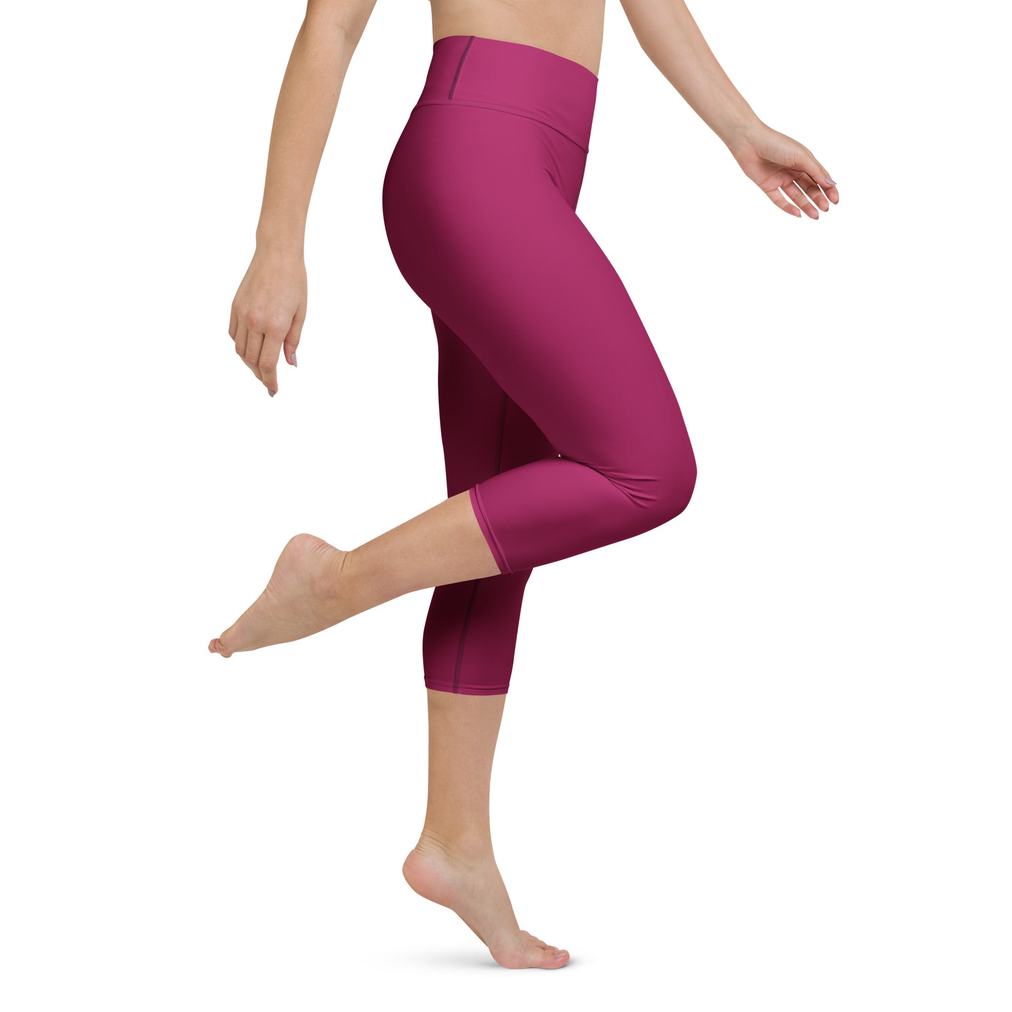 Fuchsia high-waisted capri leggings made of stretchy form-fitting fabric for comfortable activewear and yoga sessions