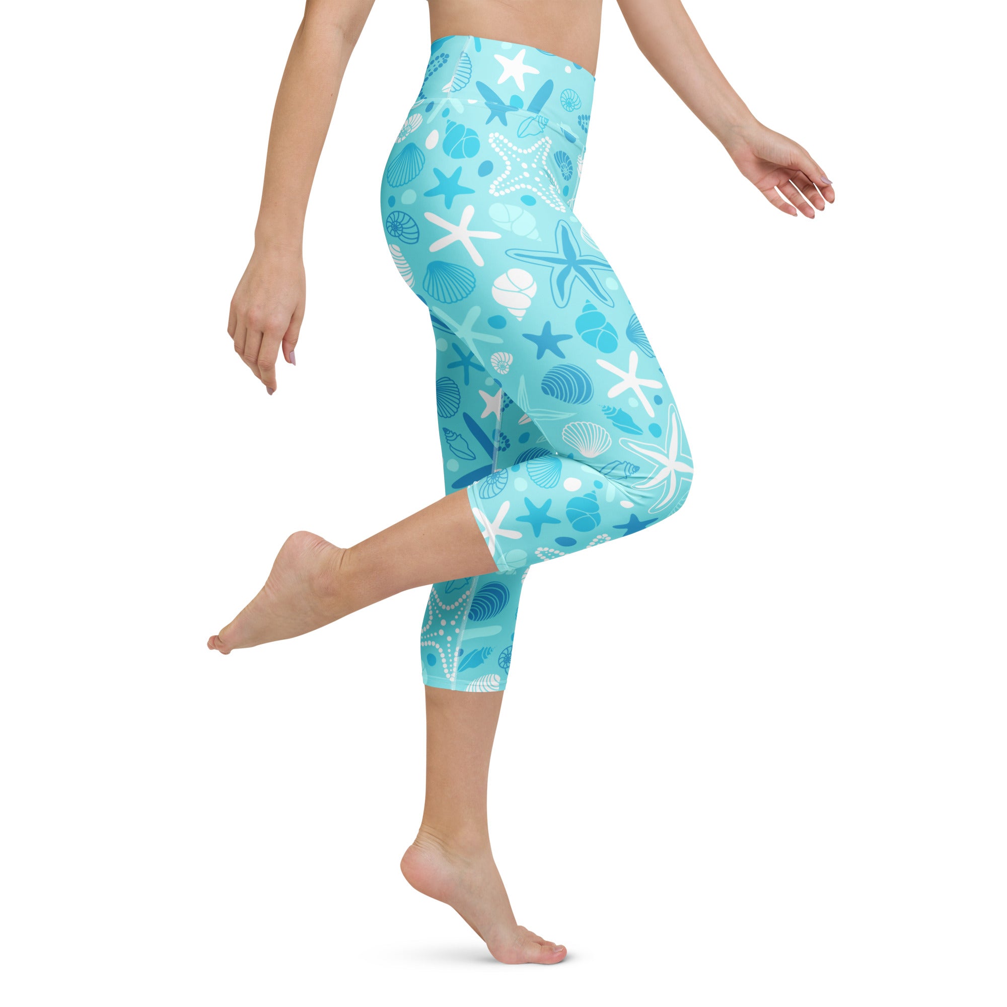 Women’s turquoise and white high-rise starfish and shells capri leggings with moisture-wicking soft stretch fabric