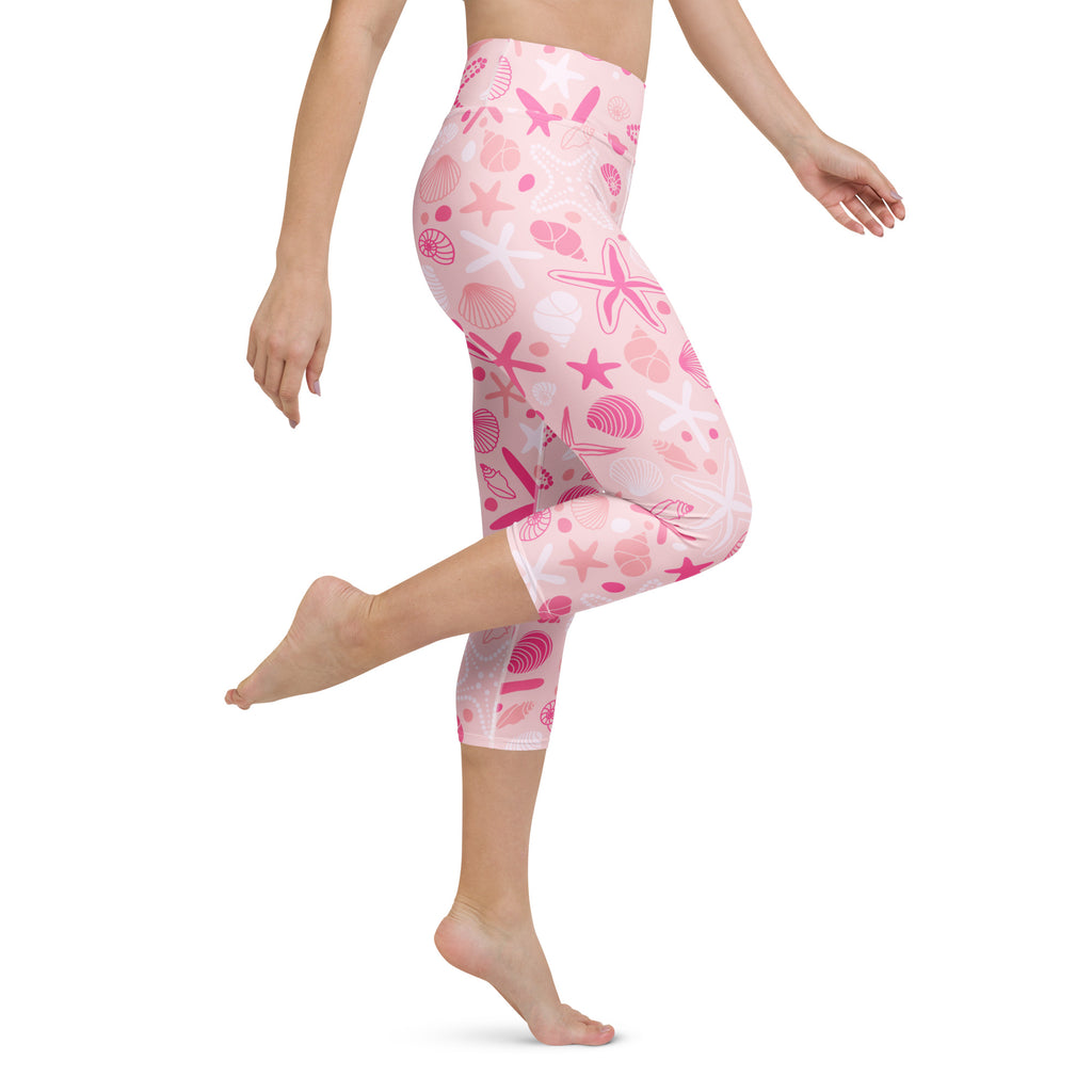 Women’s pink and white seashell-patterned buttery soft high-rise capri leggings for moisture-wicking yoga workouts