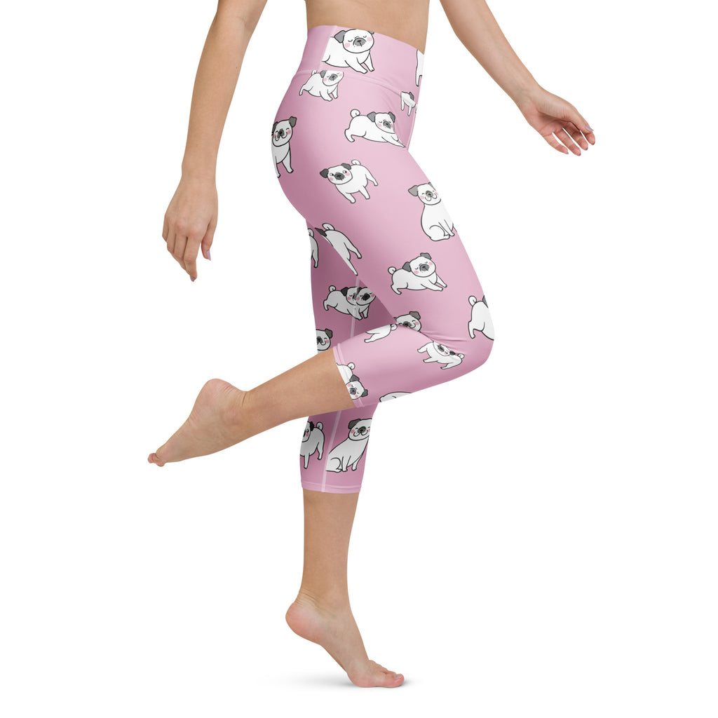 Women’s pink high-rise pug capri leggings with buttery soft moisture-wicking fabric and playful white pug pattern