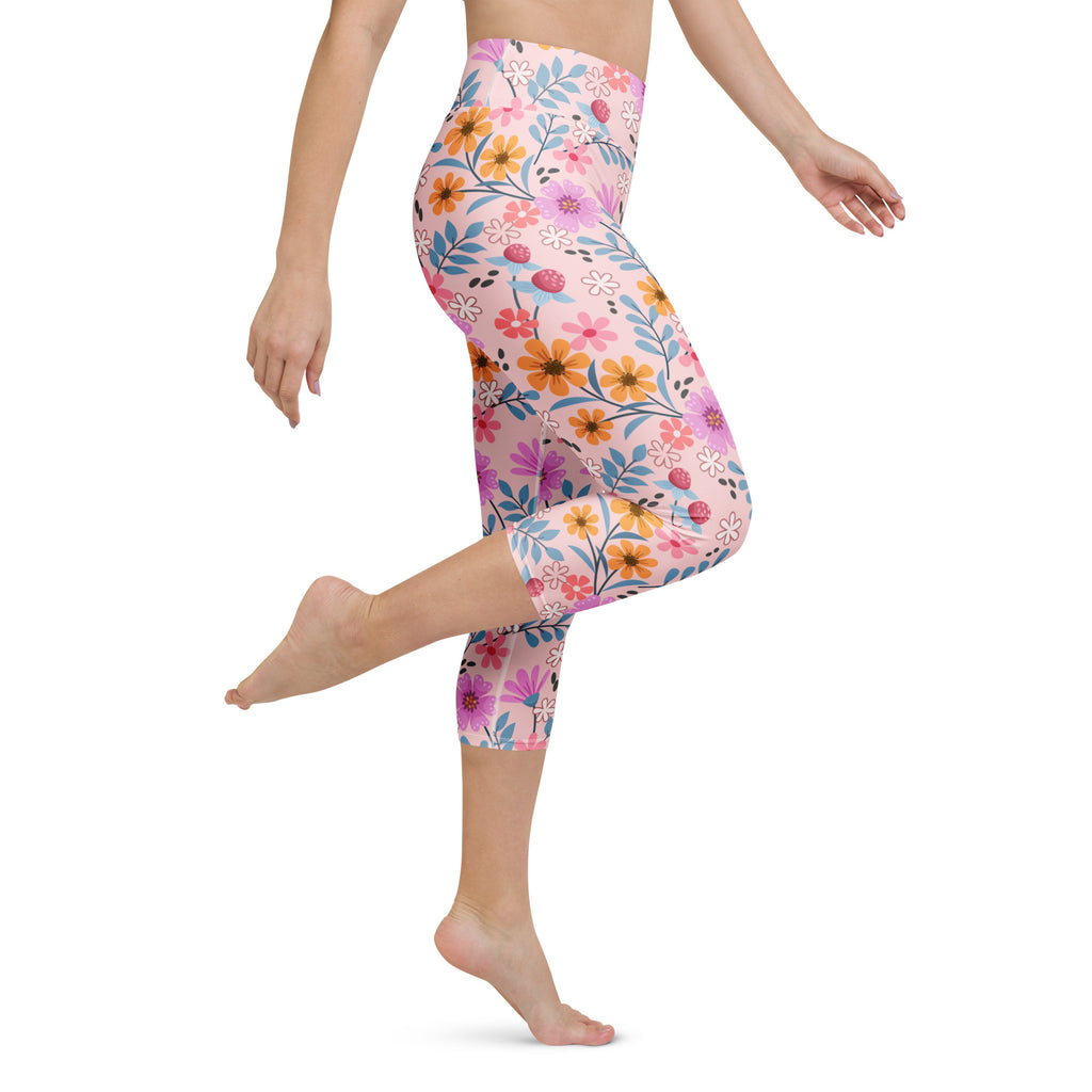 Women’s pink floral buttery soft high-rise yoga capri leggings with vibrant flowers and moisture-wicking fabric