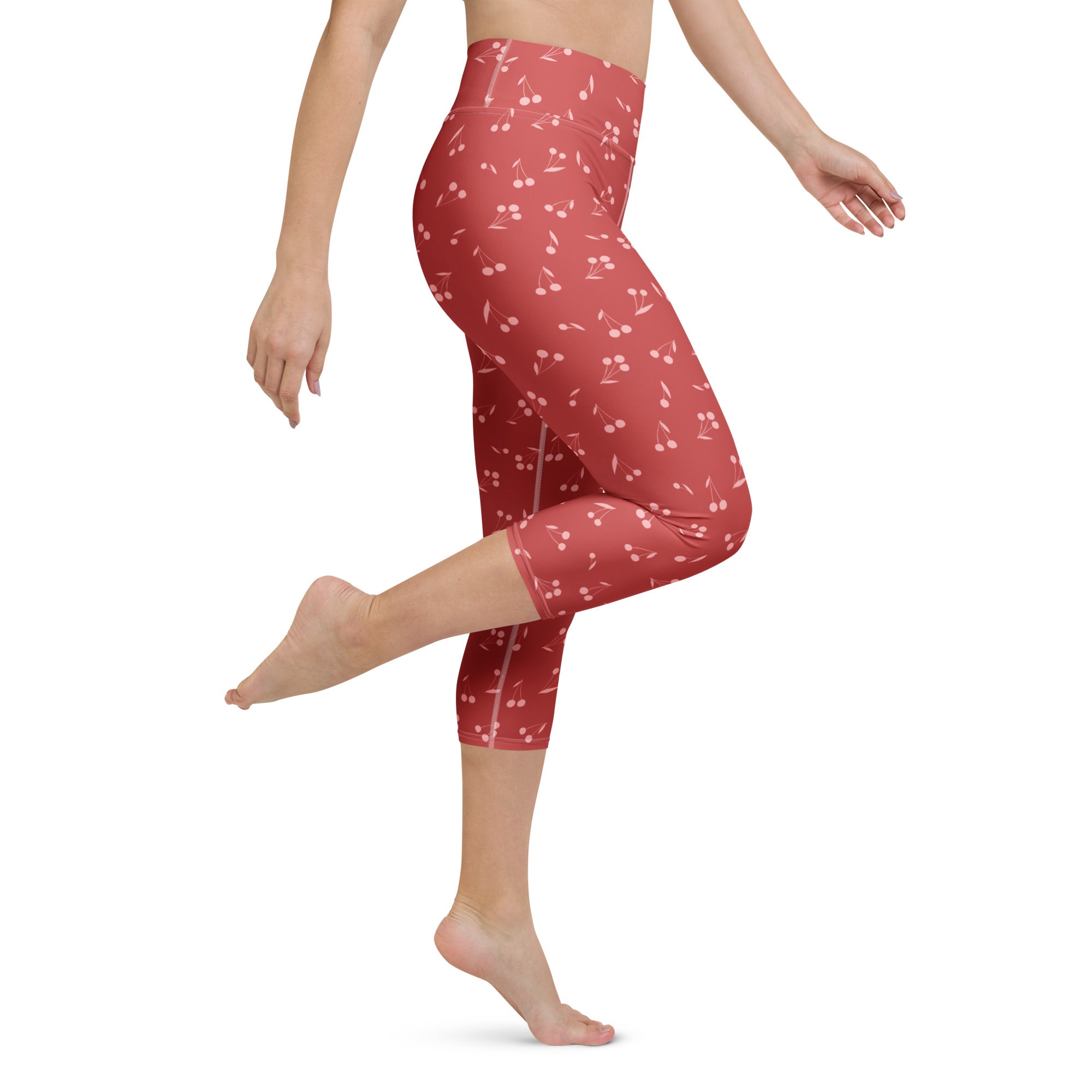 Women’s high-rise buttery soft yoga capri leggings in red with cherry and musical note pattern and moisture-wicking fabric