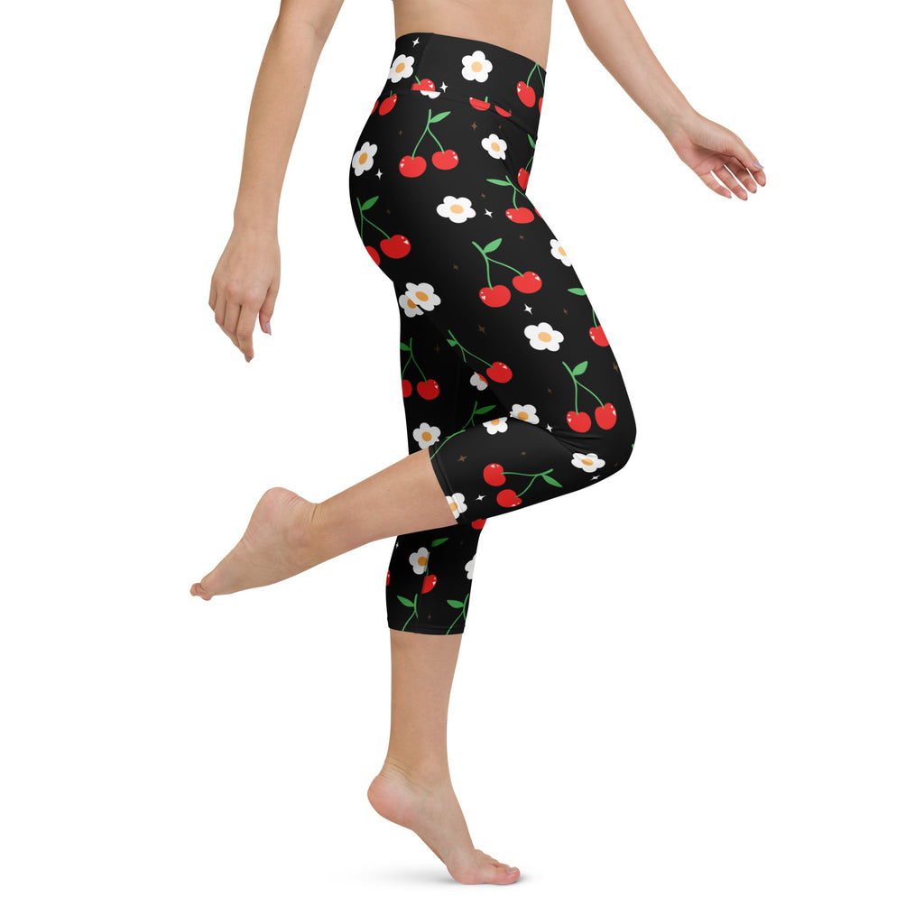 Women’s black high-rise buttery soft yoga capri leggings with red cherries green stems and white flowers pattern