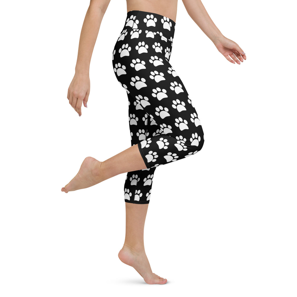Women’s black high-rise buttery soft yoga capri leggings with white paw print pattern moisture-wicking stretchy