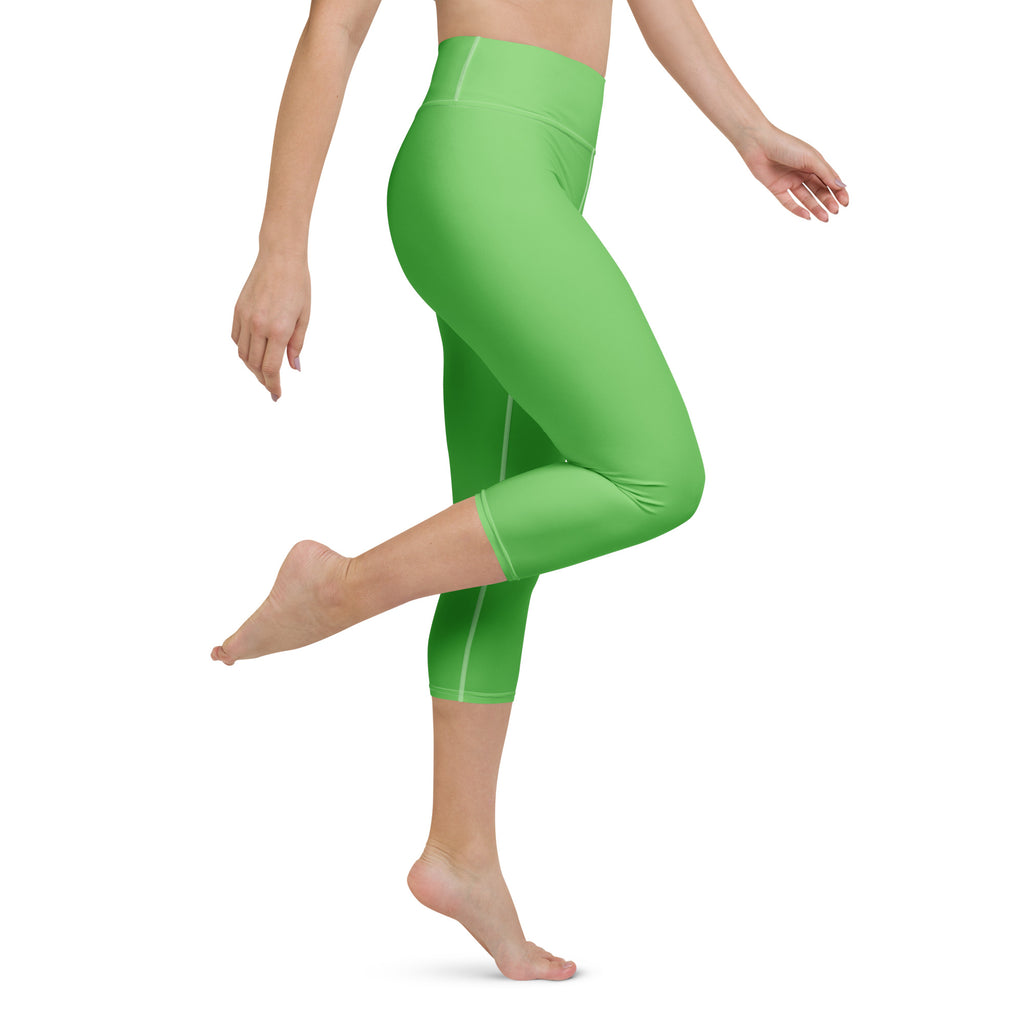 Women’s bright green buttery soft high-rise capri leggings with moisture-wicking fabric and subtle white side stripes
