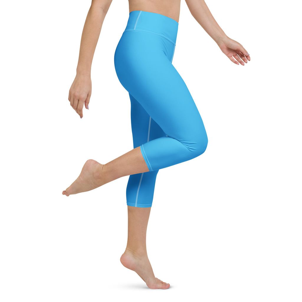 Women’s sky blue buttery soft high-rise yoga capri leggings with subtle white side stripes and moisture-wicking fabric