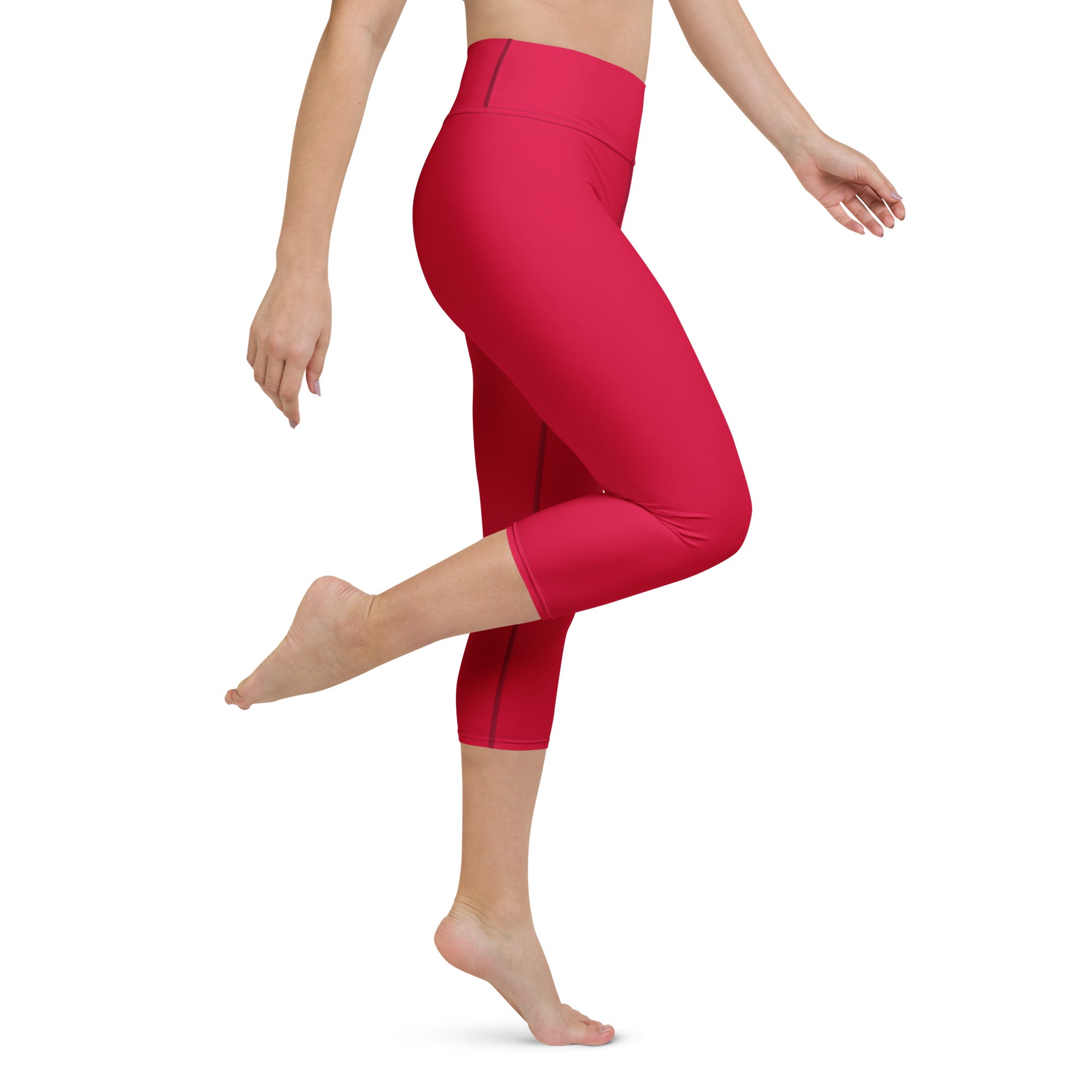 Women’s bright pink high-rise buttery soft yoga capri leggings made of stretchy moisture-wicking fabric