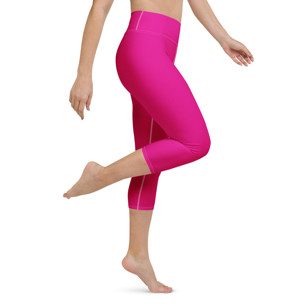 Women’s hot pink buttery soft high-rise capri leggings with subtle white side stripes moisture-wicking activewear