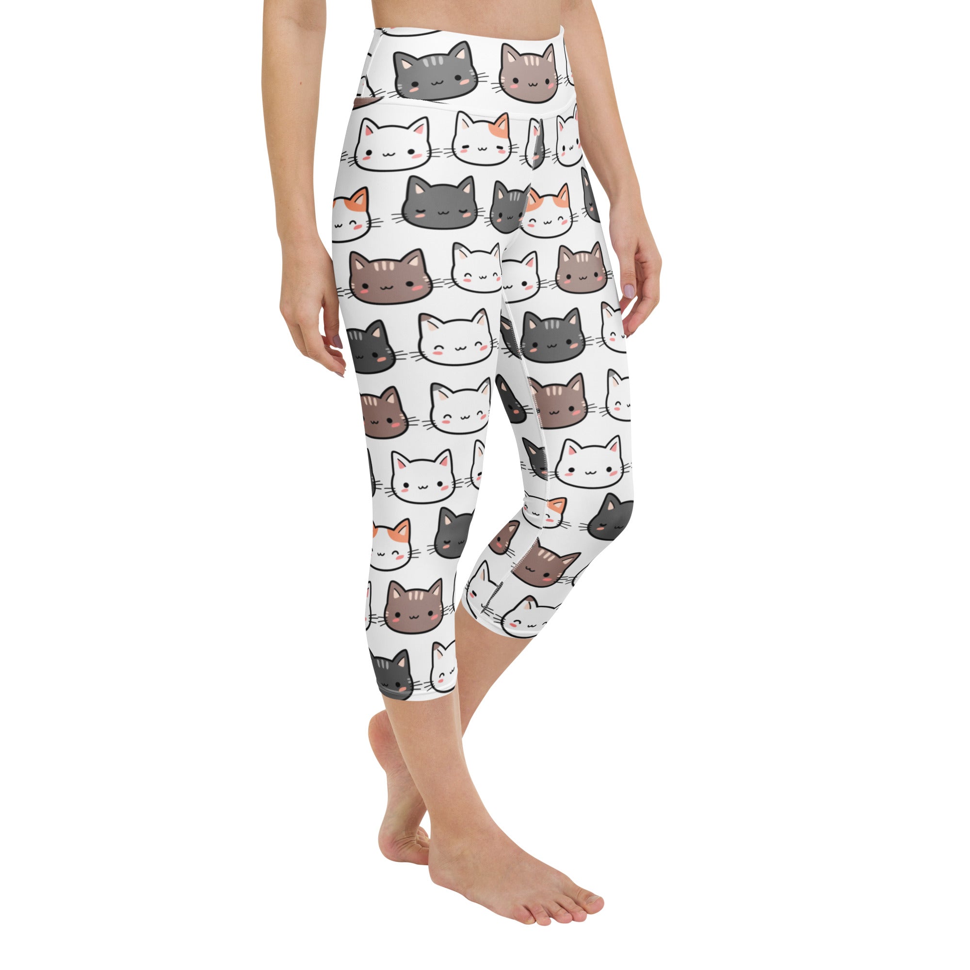 White capri leggings with playful gray white and brown cartoon cats made of buttery soft moisture-wicking fabric