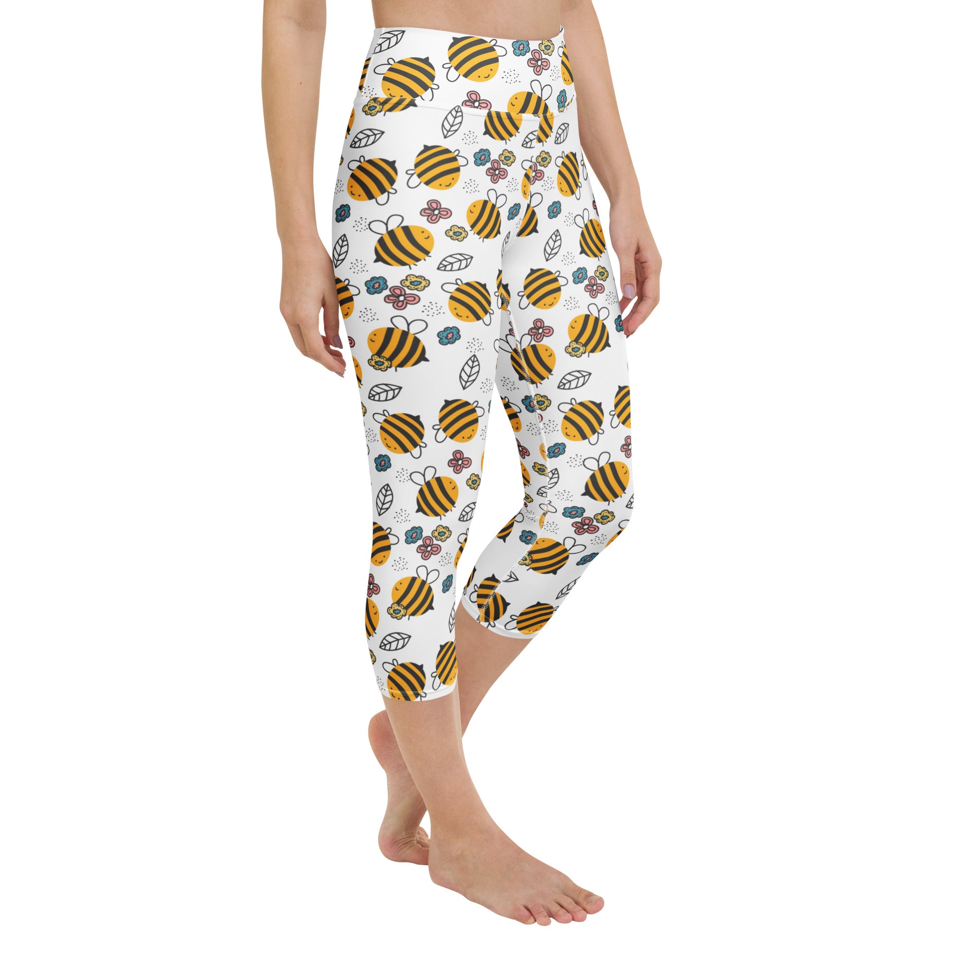 White capri leggings with yellow and black bee floral pattern high-rise buttery soft moisture-wicking fabric
