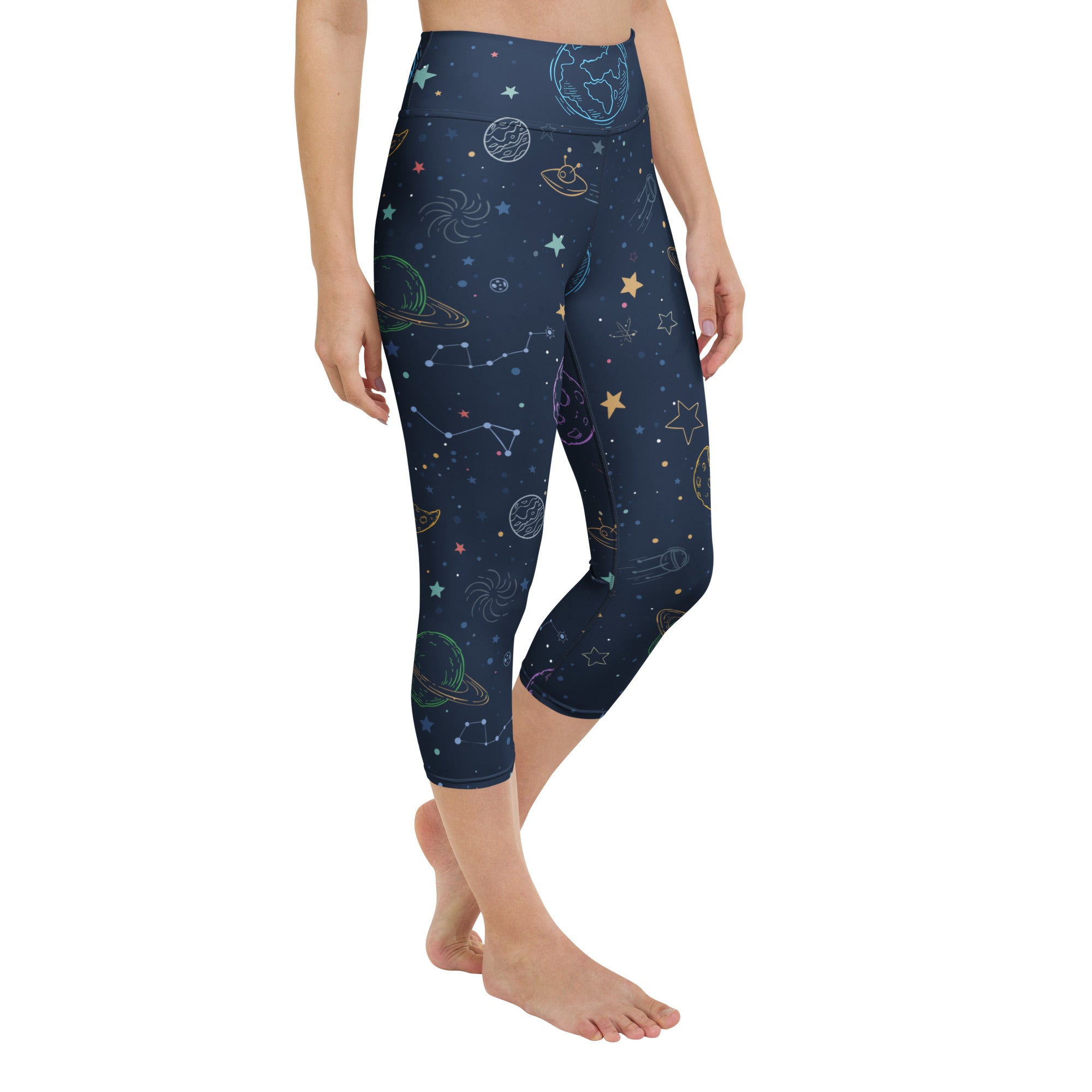 Dark blue women’s buttery soft high-rise capri leggings with vibrant cosmic planets stars and constellations design