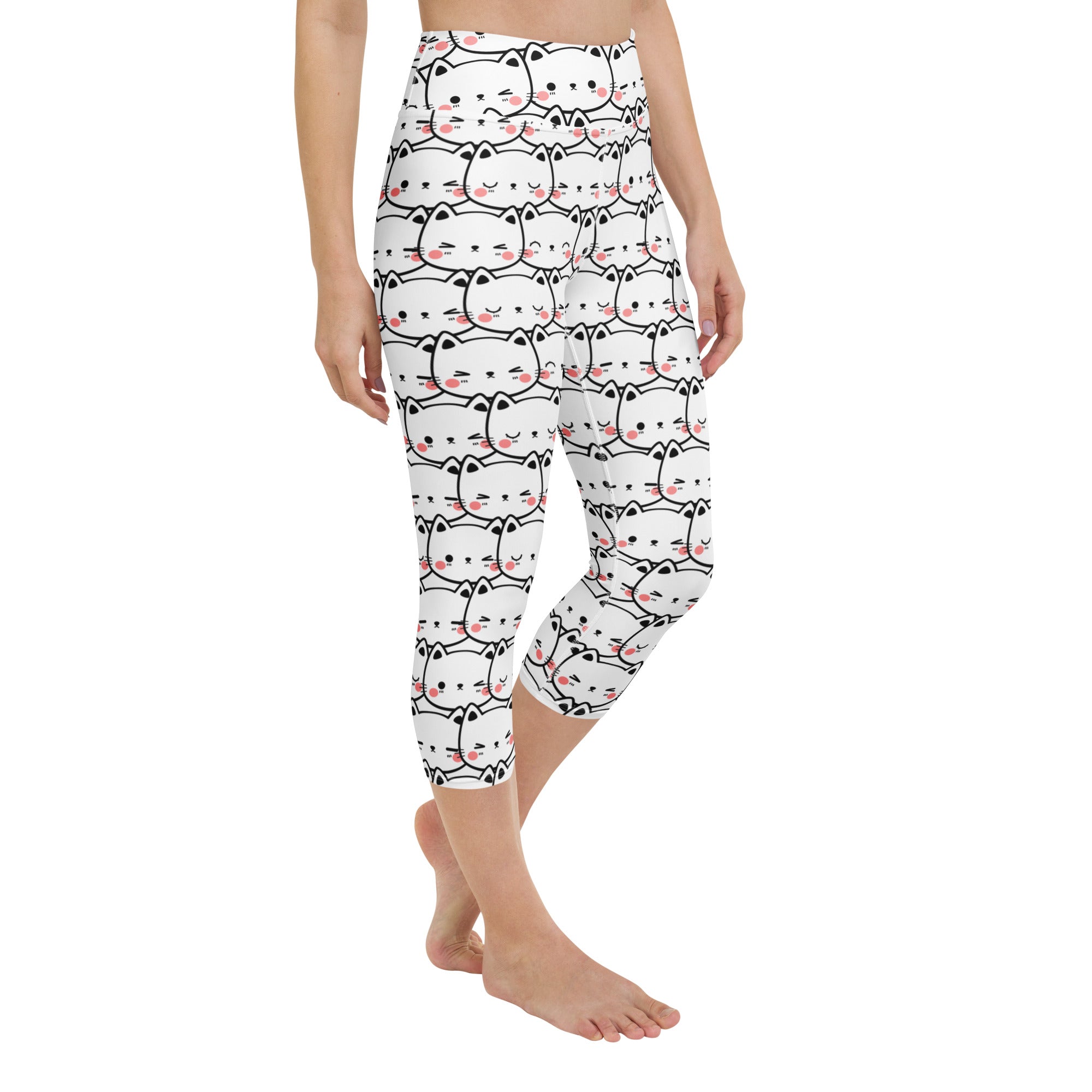 White capri leggings with black outlined cartoon cats and pink blush cheeks buttery soft high rise activewear pants