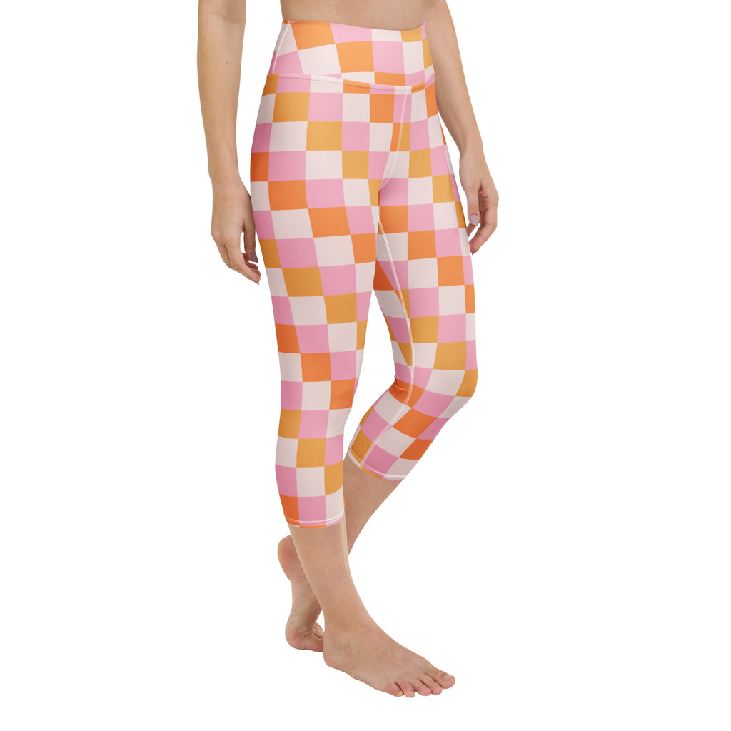 Women’s pink and orange checkerboard buttery soft yoga capri leggings with high-rise moisture-wicking waistband