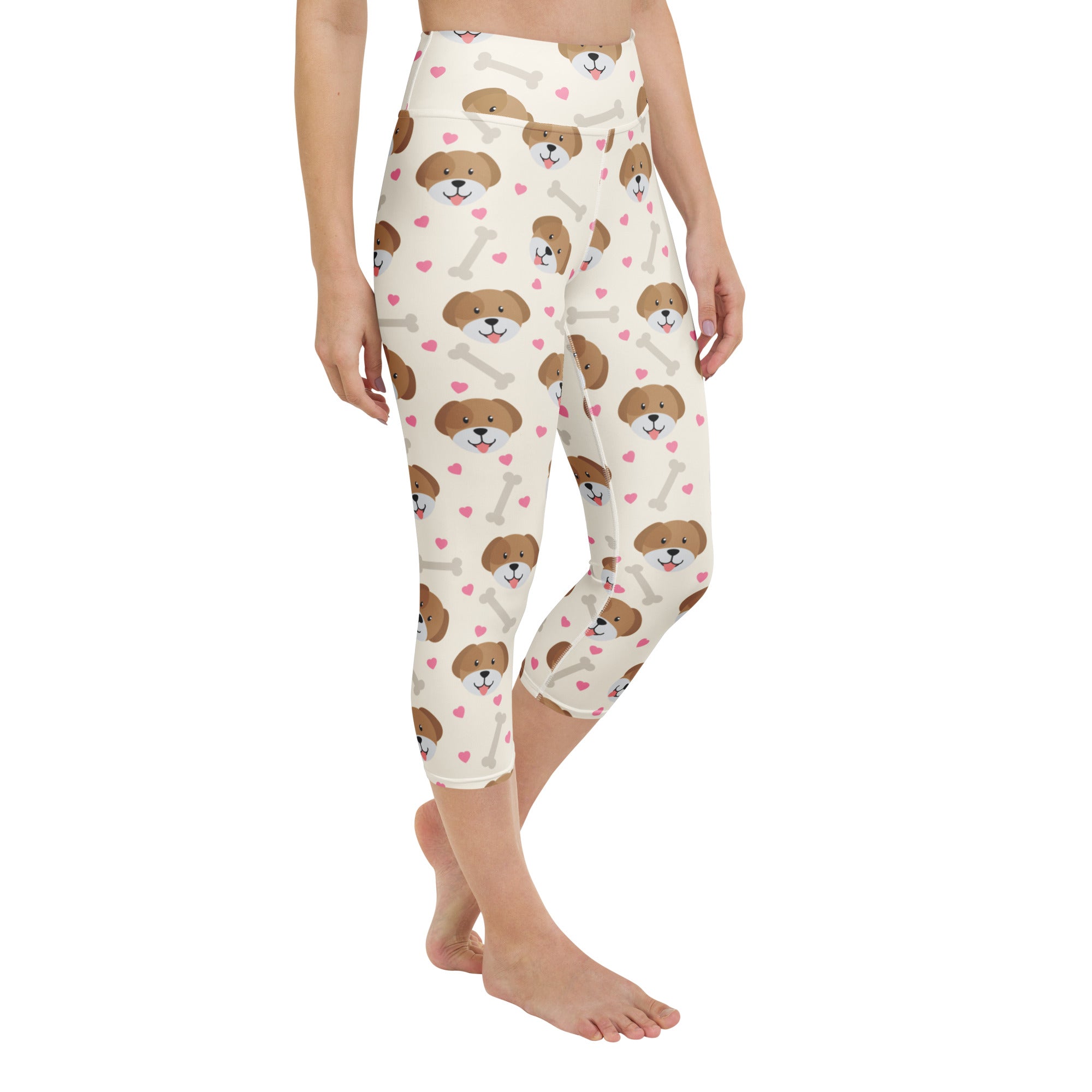 Cream-colored women’s puppy and bone buttery soft capri leggings with high-rise waist and playful puppy pattern