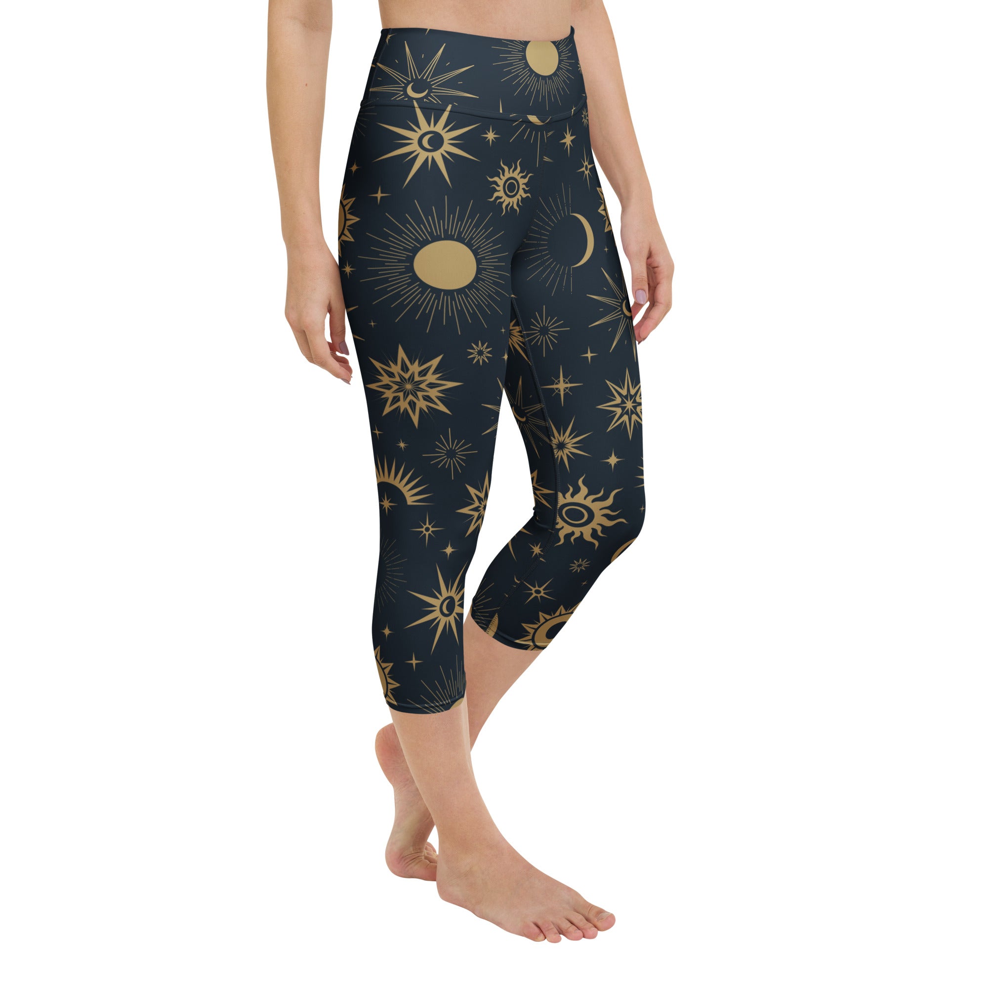 Dark blue high-rise capri leggings with gold celestial sun moon star pattern buttery soft moisture-wicking fabric