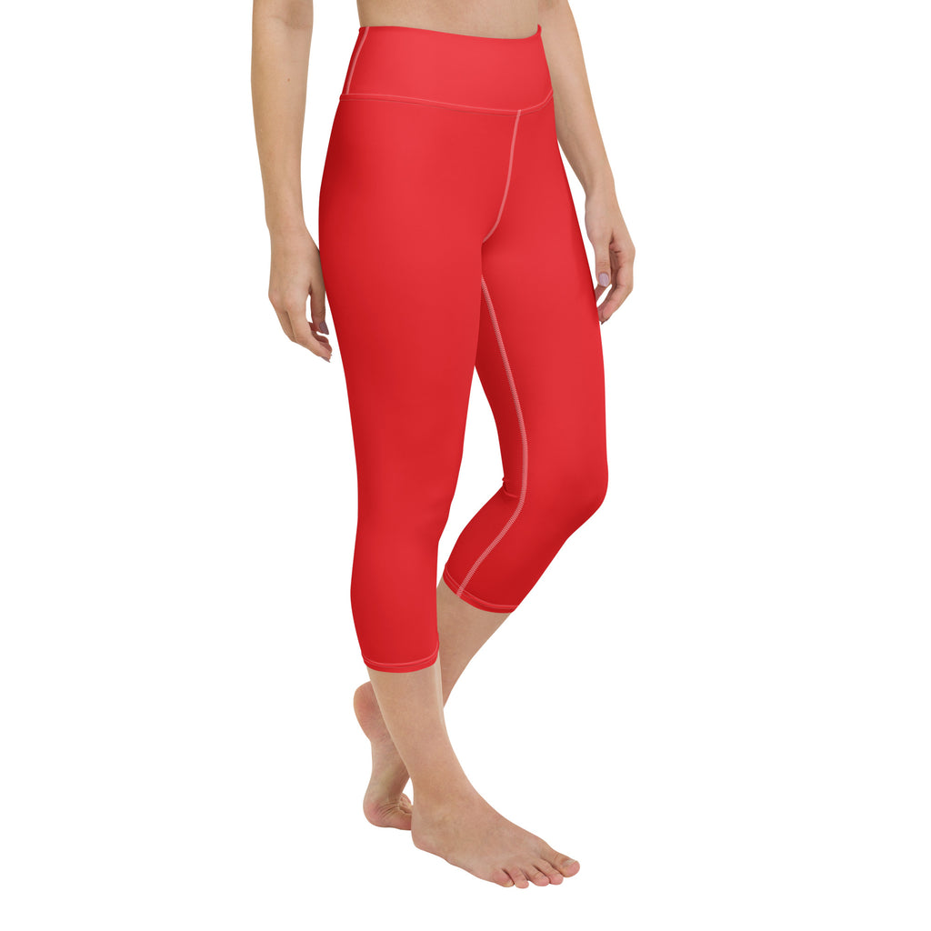 Women’s red high-rise buttery soft yoga capri leggings with subtle white stitching and moisture-wicking stretch fabric