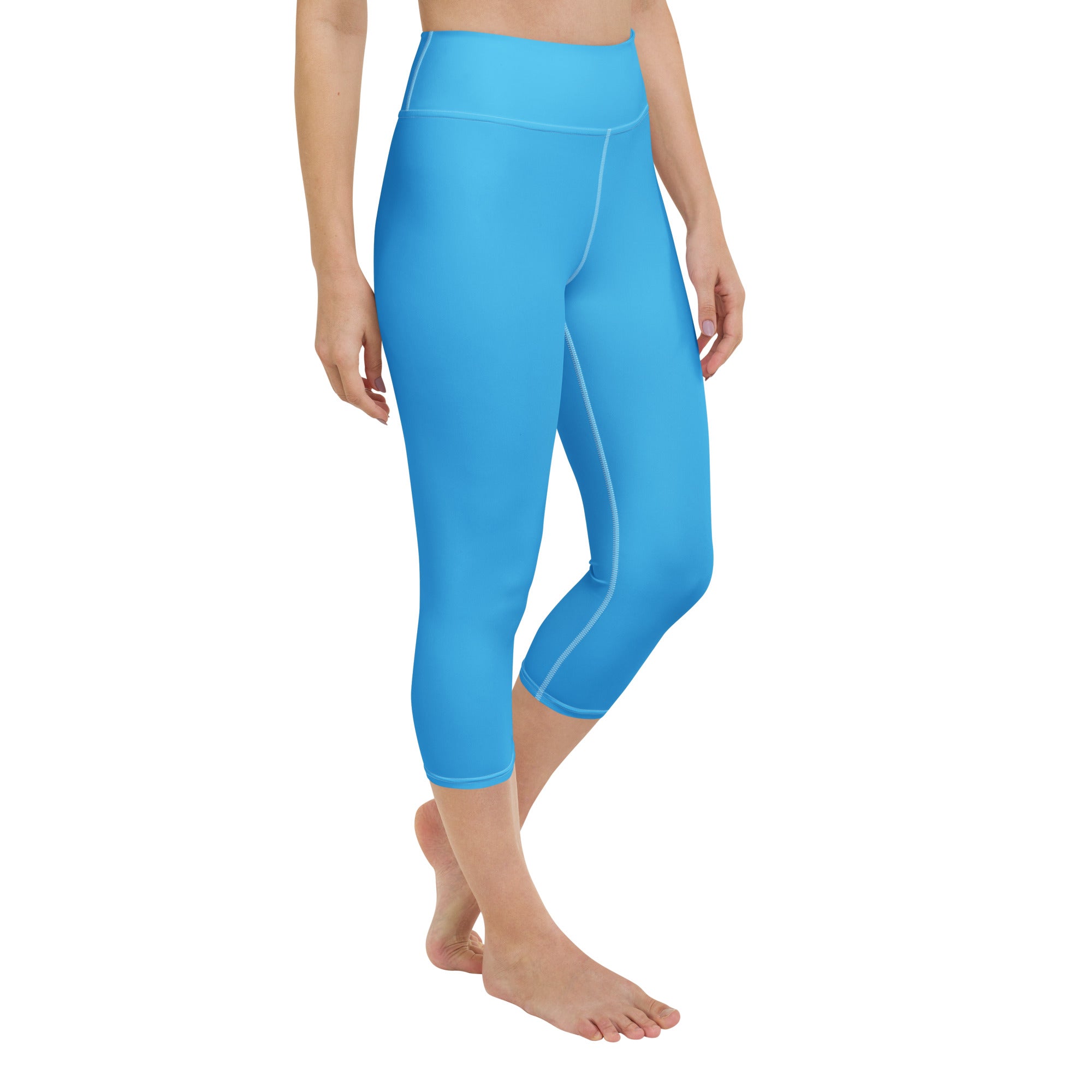 Women’s sky blue buttery soft high-rise yoga capri leggings with subtle white stitching and moisture-wicking stretch