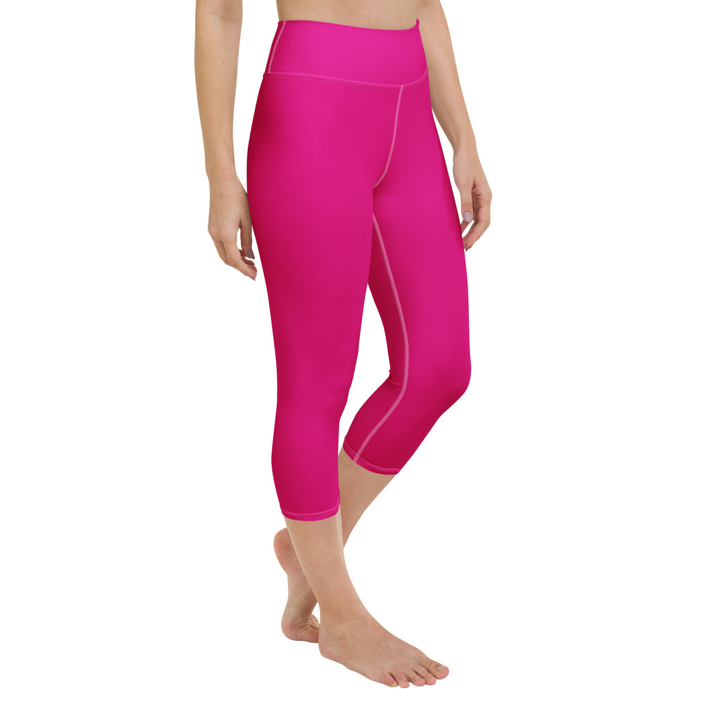 Bright fuchsia high-rise buttery soft yoga capri leggings with subtle matching stitching and moisture-wicking fabric