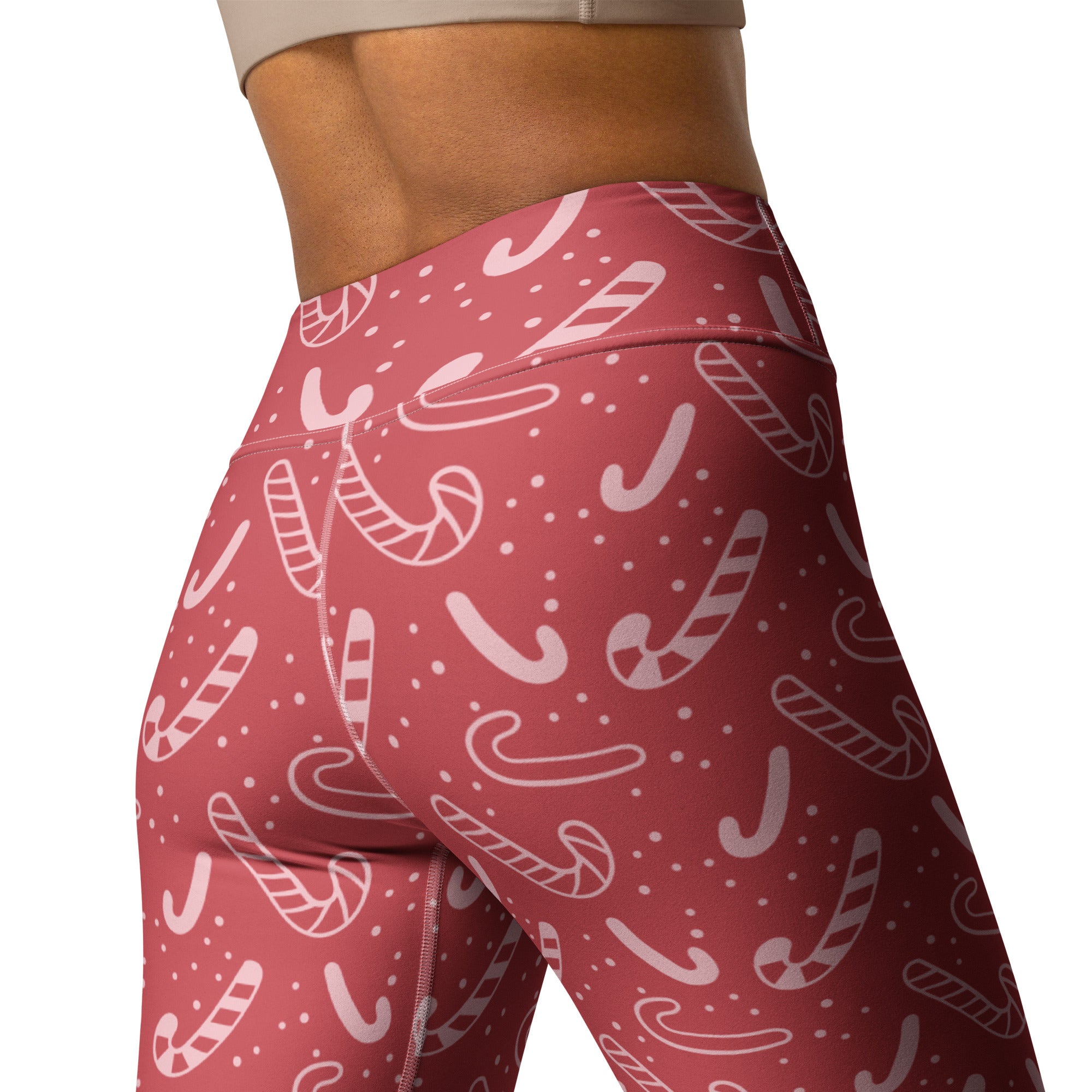 Women’s red high-waisted buttery soft yoga leggings with festive white candy cane and dot pattern for Christmas