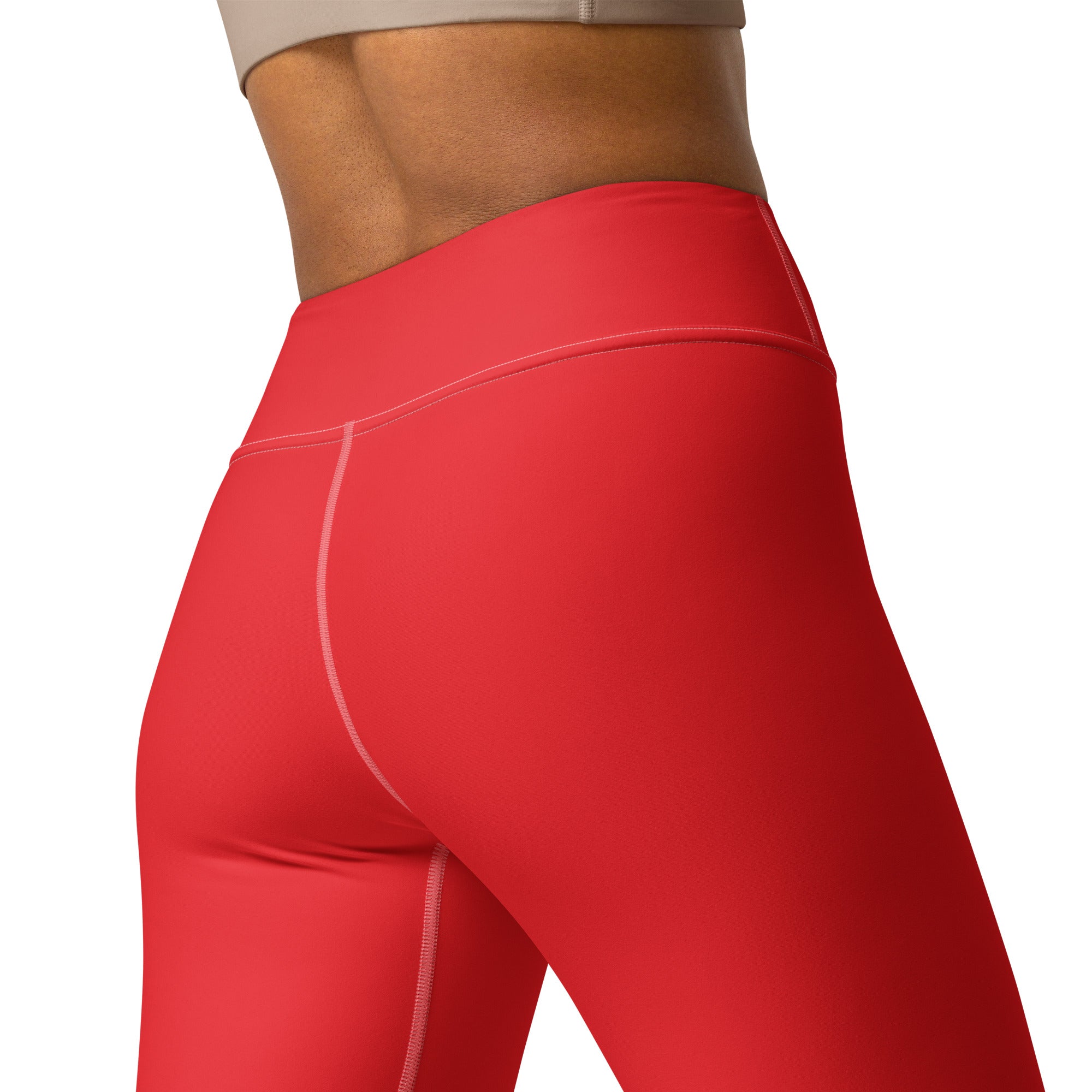 Bright red high waisted buttery soft yoga leggings with subtle pink stitching along the seams for women