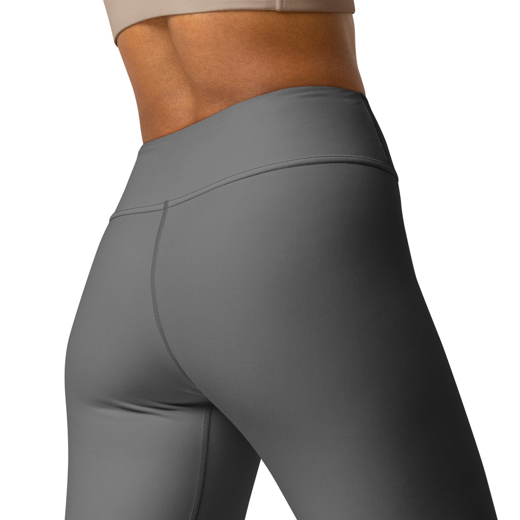 High-waisted women’s gray buttery soft yoga leggings with smooth form-fitting fabric and subtle seam detailing