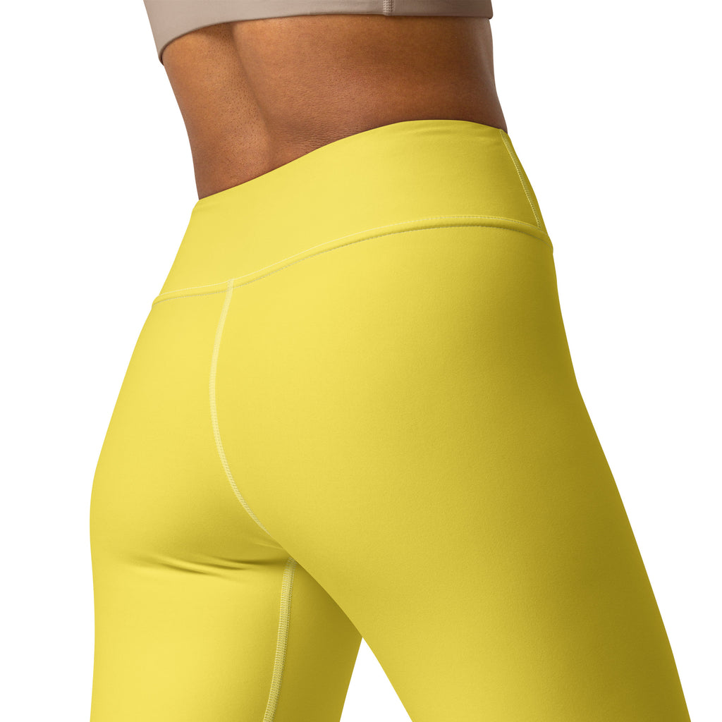 Bright yellow high-waisted women’s yoga leggings made from buttery soft stretchy fabric with subtle seam detailing