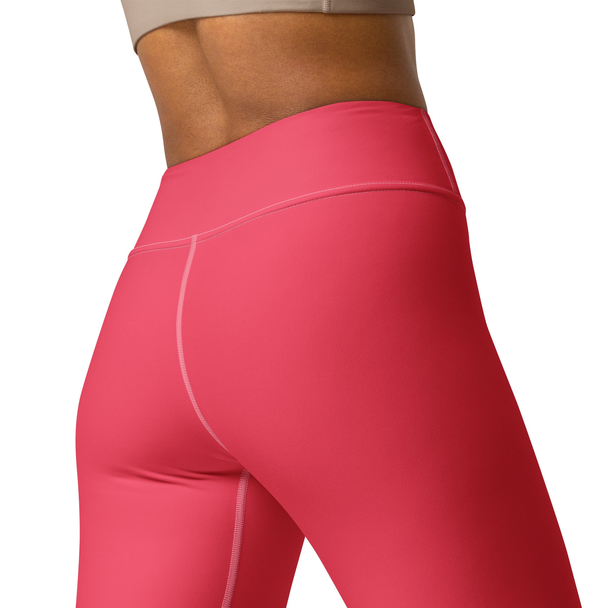 Women’s crimson pink buttery soft high-waisted yoga leggings with smooth stretchy fabric and subtle white stitching