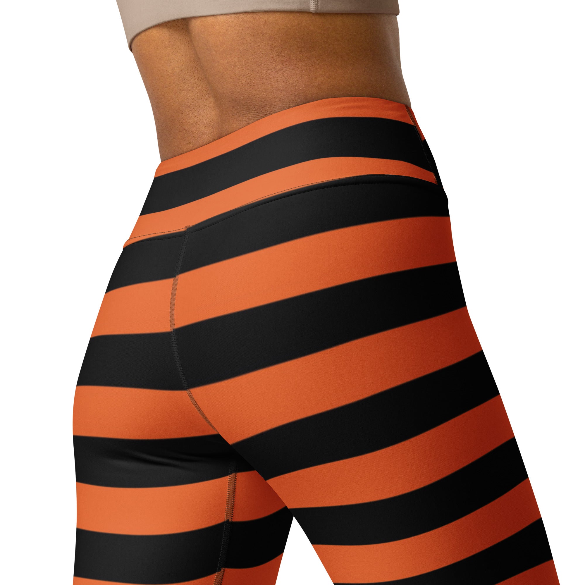 High-waisted women’s orange and black striped buttery soft yoga leggings for Halloween with bold horizontal stripes