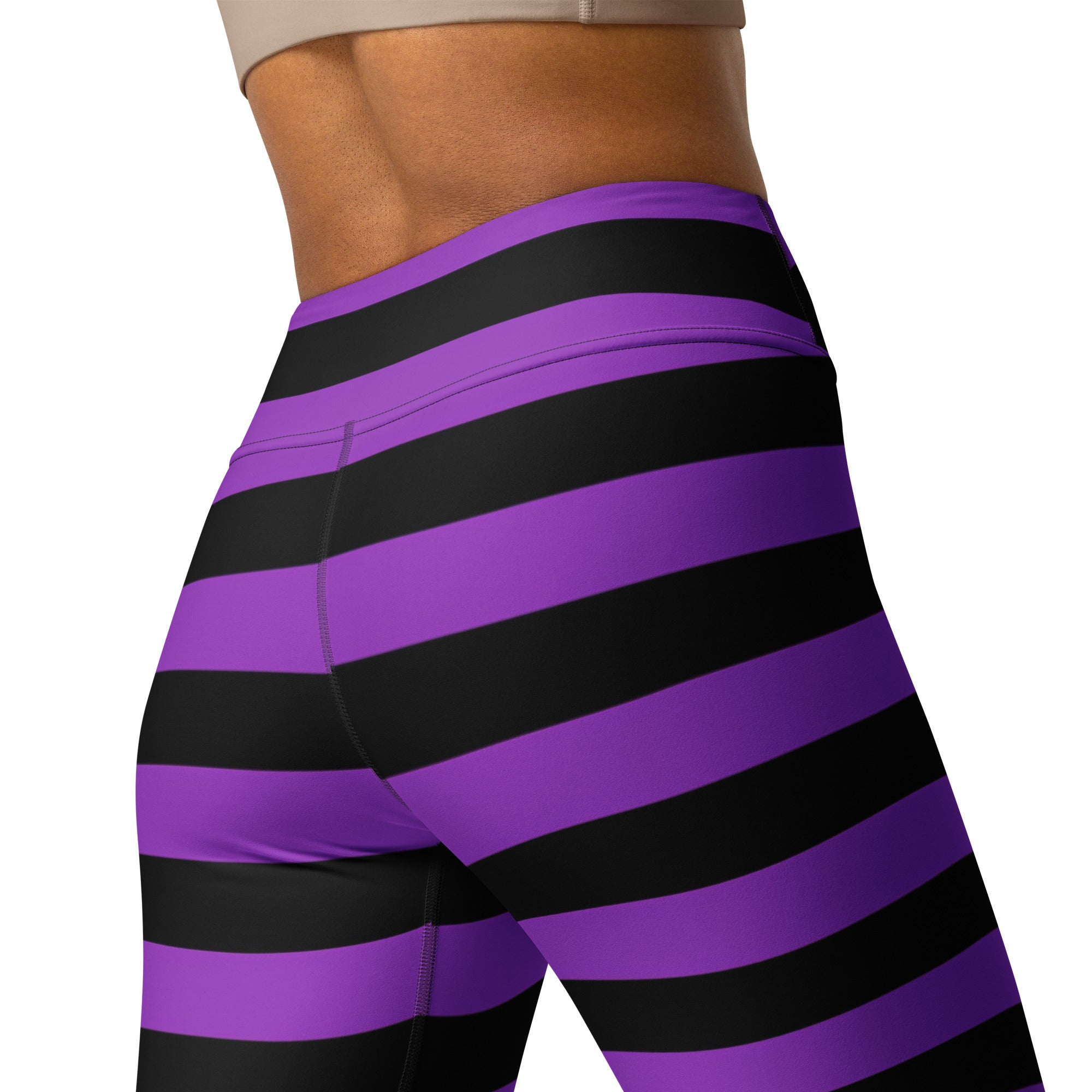 Women’s purple and black striped buttery soft high-waisted yoga leggings designed for halloween wear