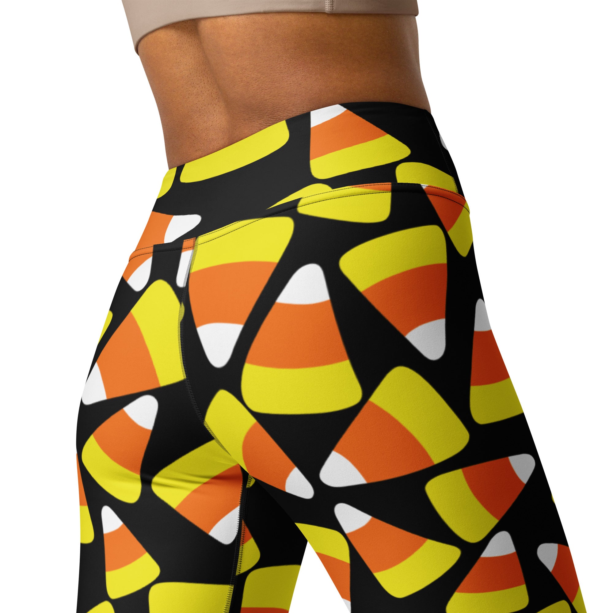 Black high-waisted buttery soft yoga leggings with orange yellow and white candy corn pattern for women