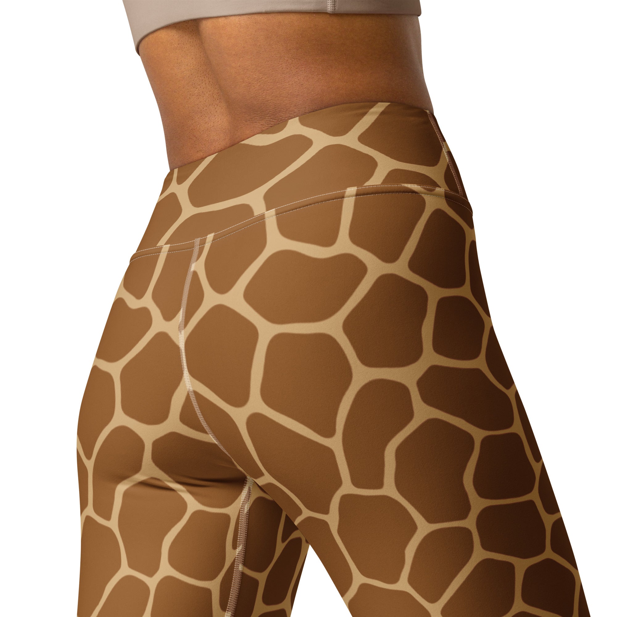 High-waisted women’s yoga leggings with realistic tan and brown giraffe print made from stretchy athletic fabric