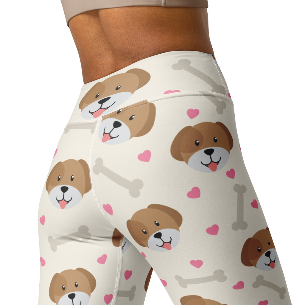 Cream-colored buttery soft women’s yoga leggings with brown cartoon dogs pink hearts and gray bones pattern