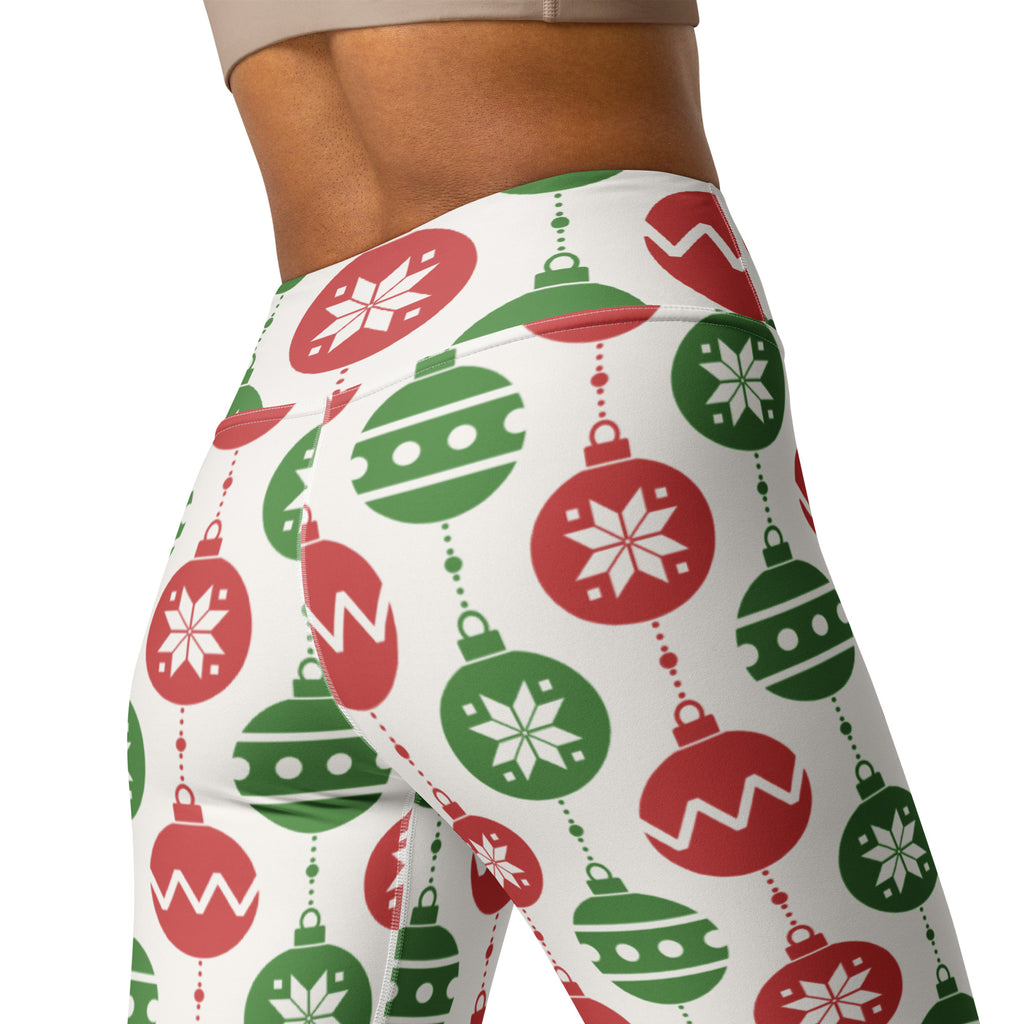 White high-waisted buttery soft yoga leggings with festive red and green christmas ornament and snowflake pattern