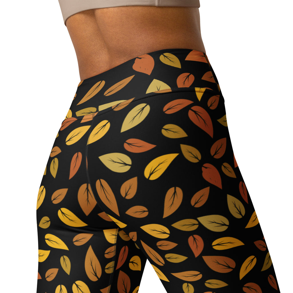 Women’s buttery soft black yoga leggings with vibrant gold yellow orange autumn leaves pattern