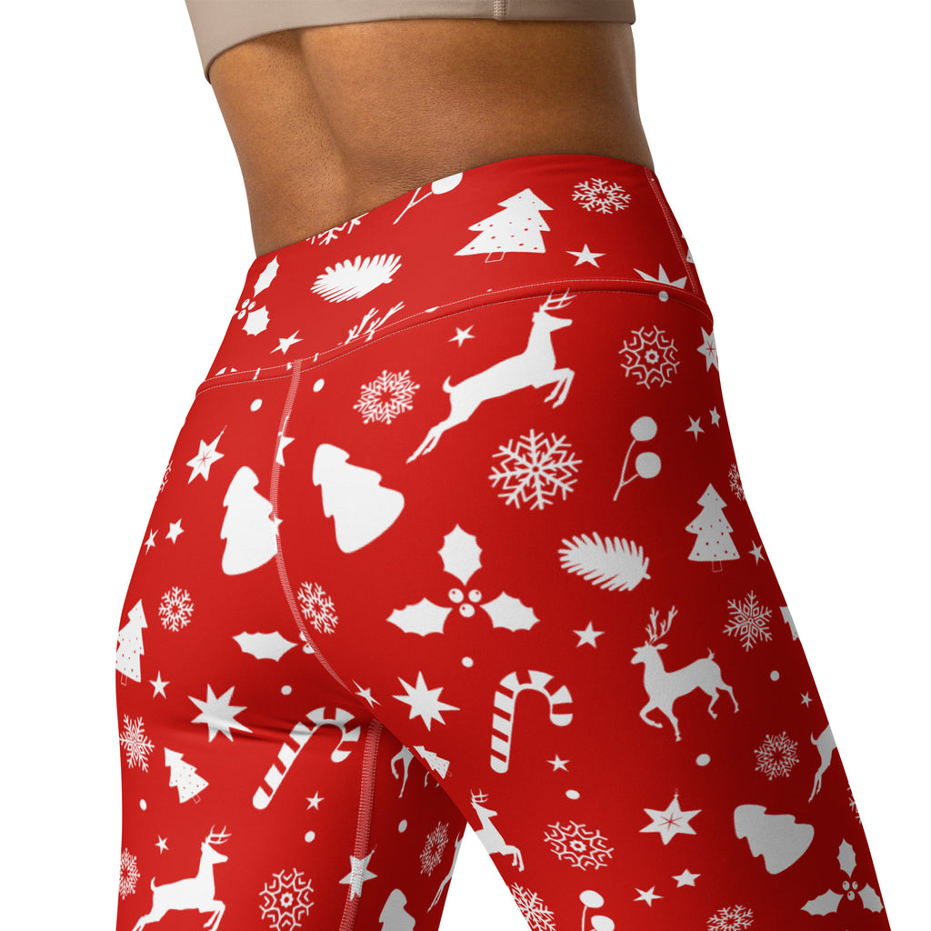 Women’s red high-waisted buttery soft yoga leggings with white reindeer snowflakes trees and candy canes design
