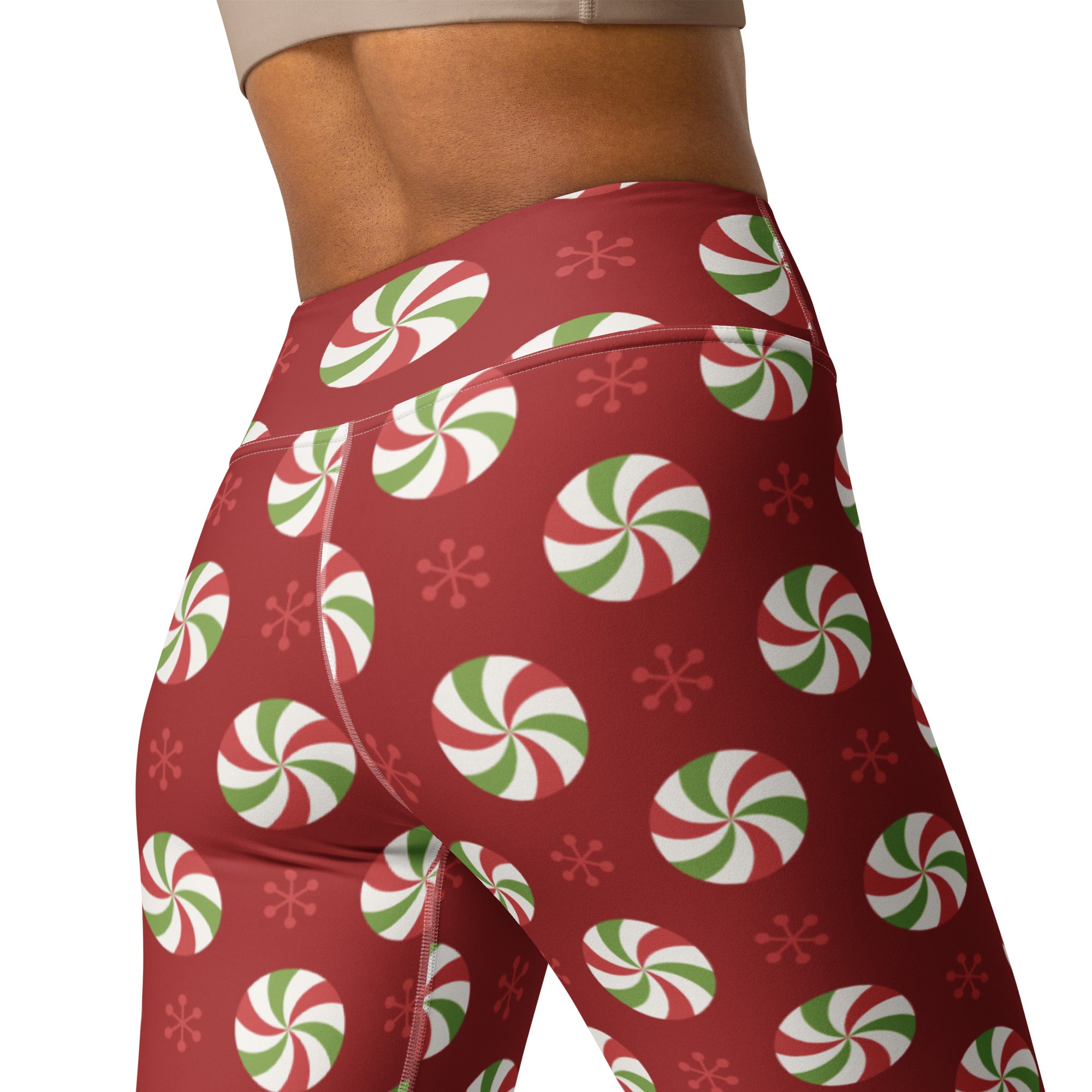 Women’s peppermint candy christmas buttery soft red high-waisted leggings with festive peppermint swirl and snowflake pattern