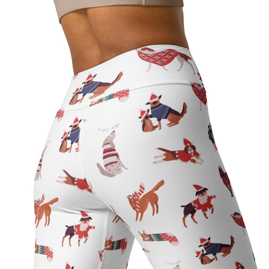 White buttery soft women’s yoga leggings with festive cartoon dogs in holiday attire on a white background