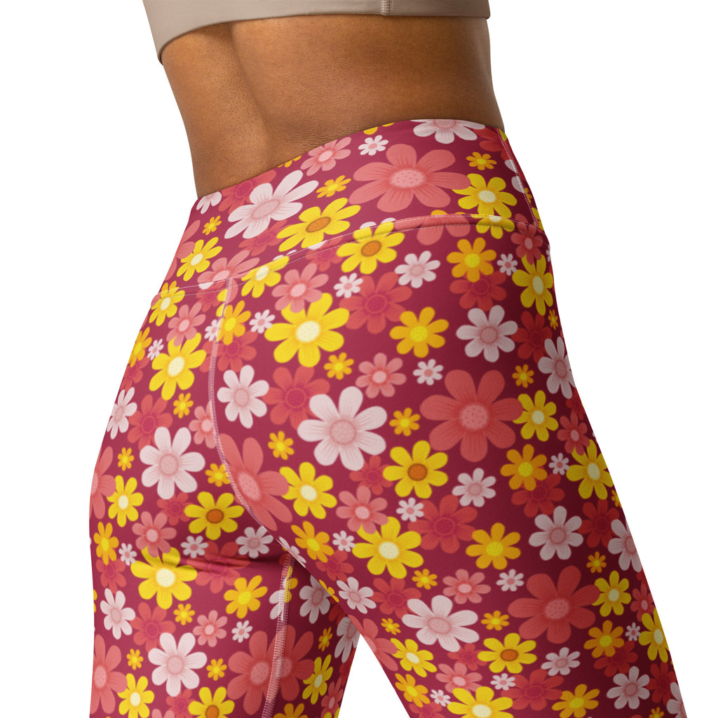 Women’s red floral buttery soft yoga leggings with high-waisted vibrant pink yellow and white daisy pattern on magenta