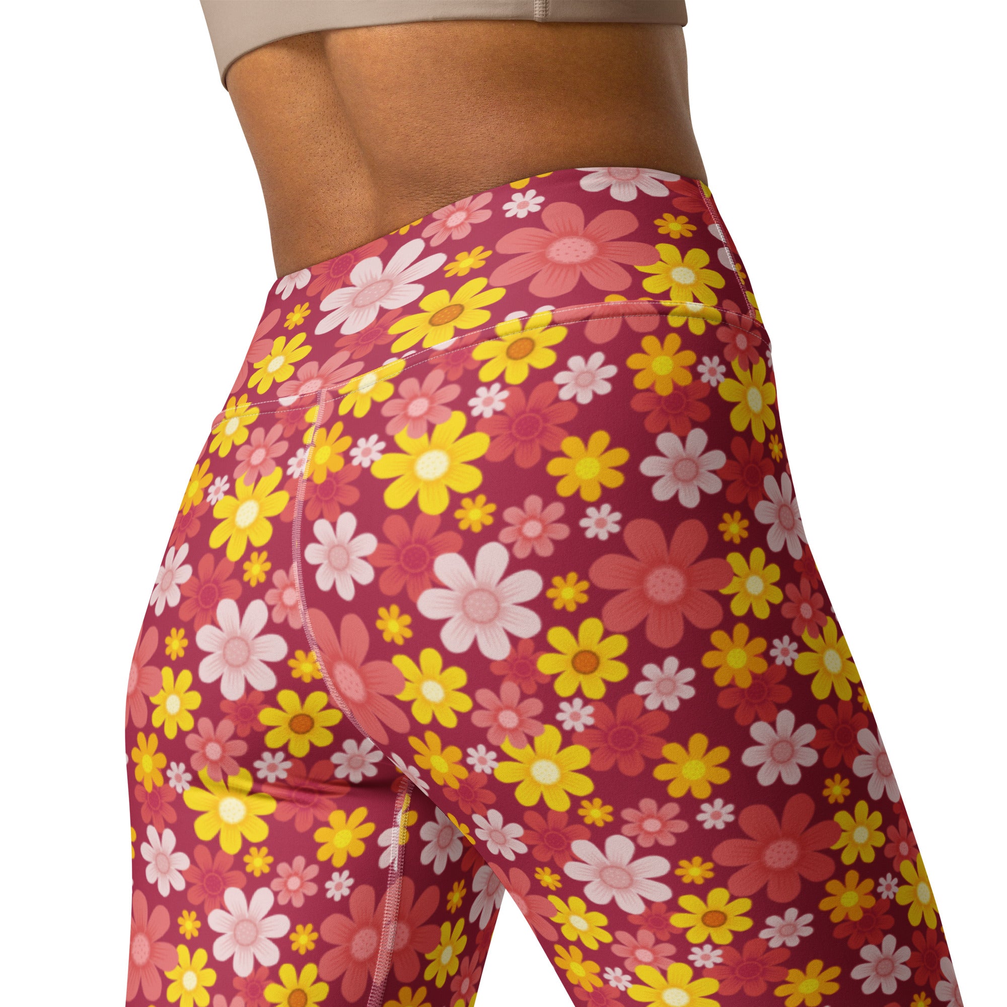 Women’s red floral buttery soft yoga leggings with high-waisted vibrant pink yellow and white daisy pattern on magenta
