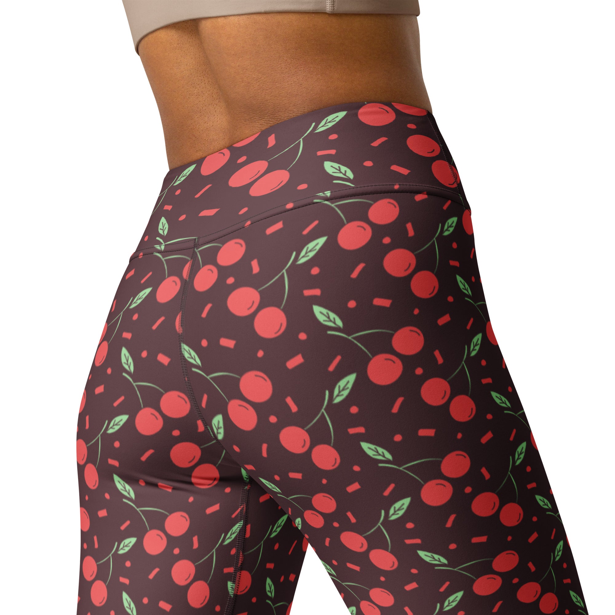 Dark brown high waisted buttery soft yoga leggings with a playful red cherry pattern and pink confetti accents
