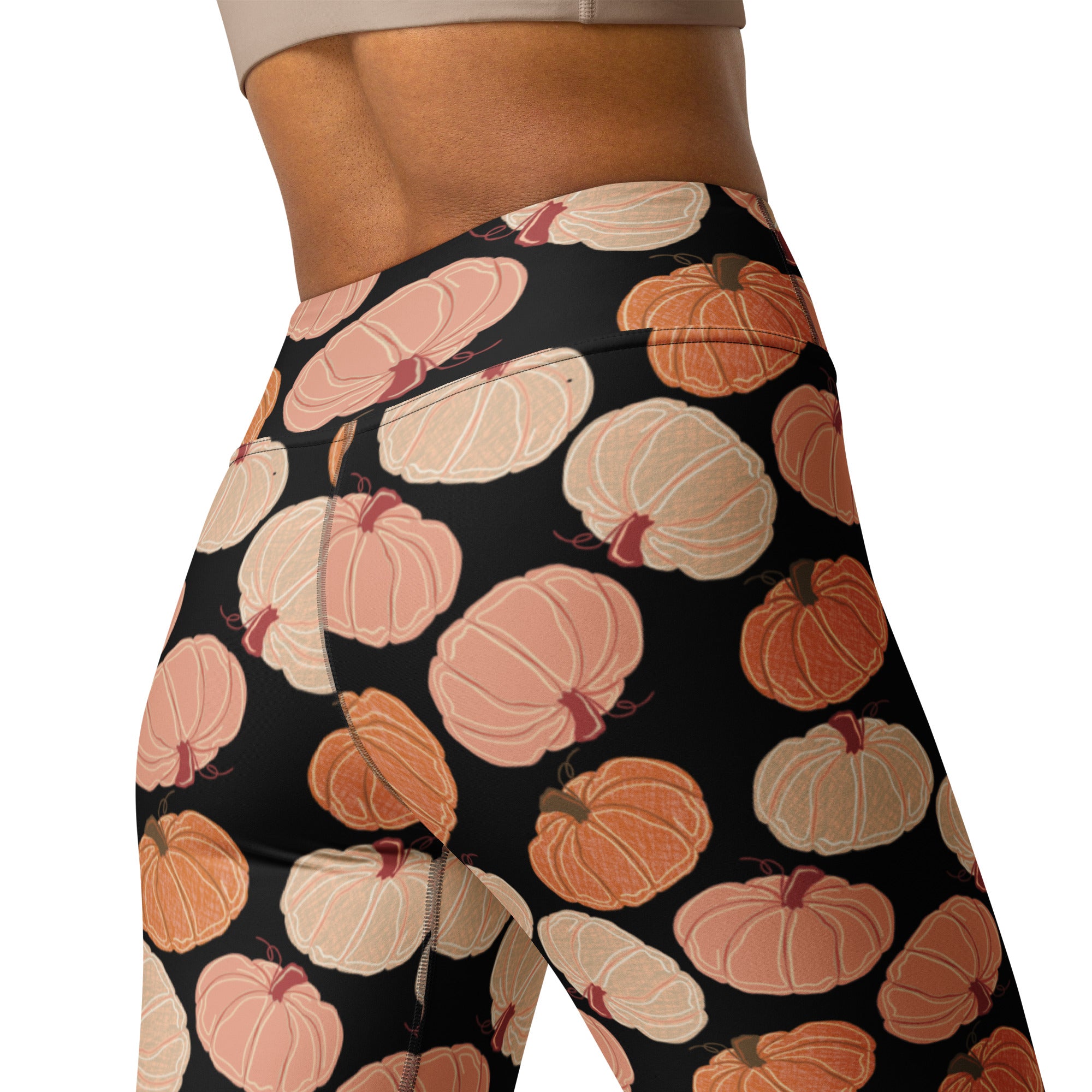 Women’s pumpkin patch buttery soft black leggings with playful peach orange and cream pumpkin illustrations