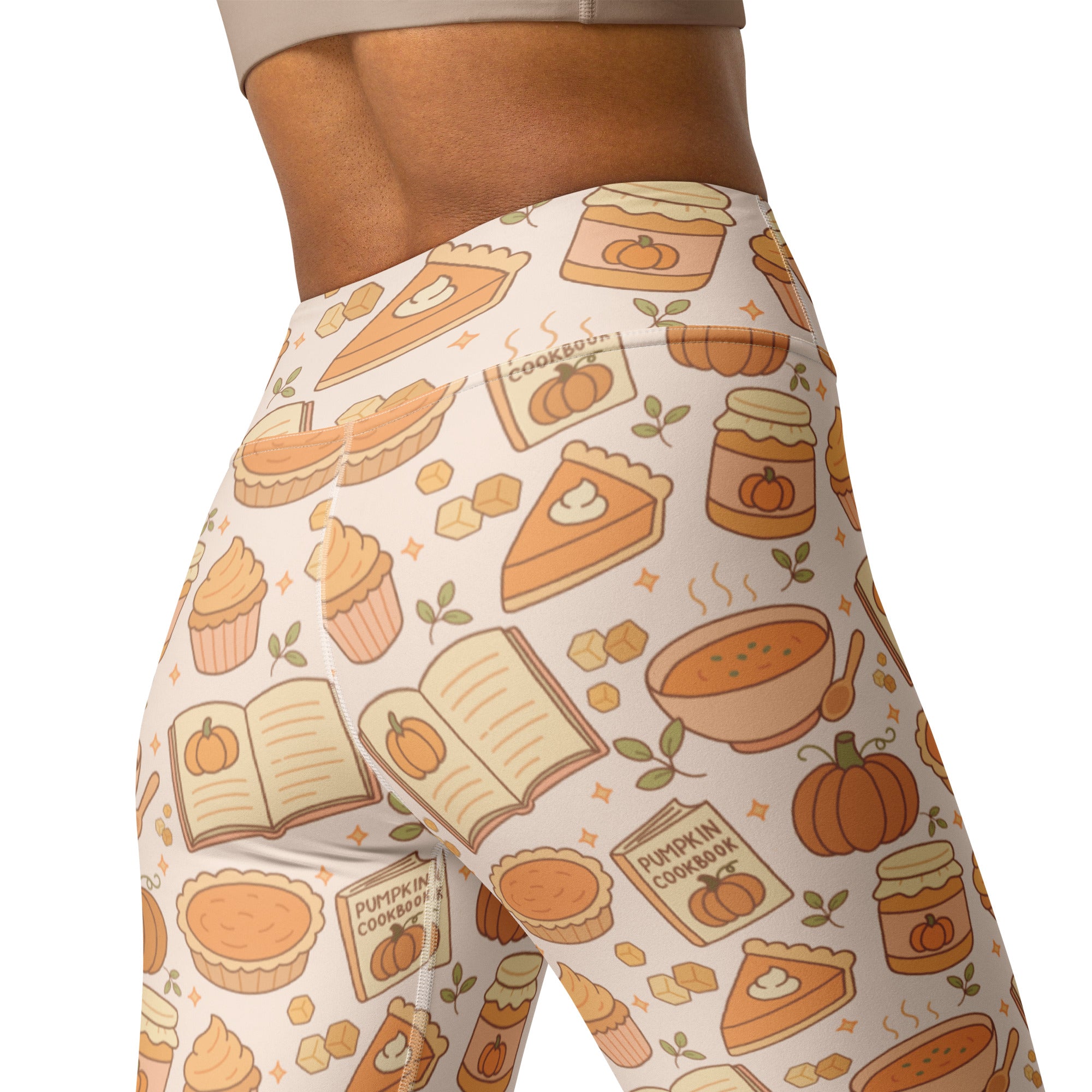 Cream-colored buttery soft high-waisted yoga leggings with autumn pumpkin pie cupcake and cookbook pattern for women