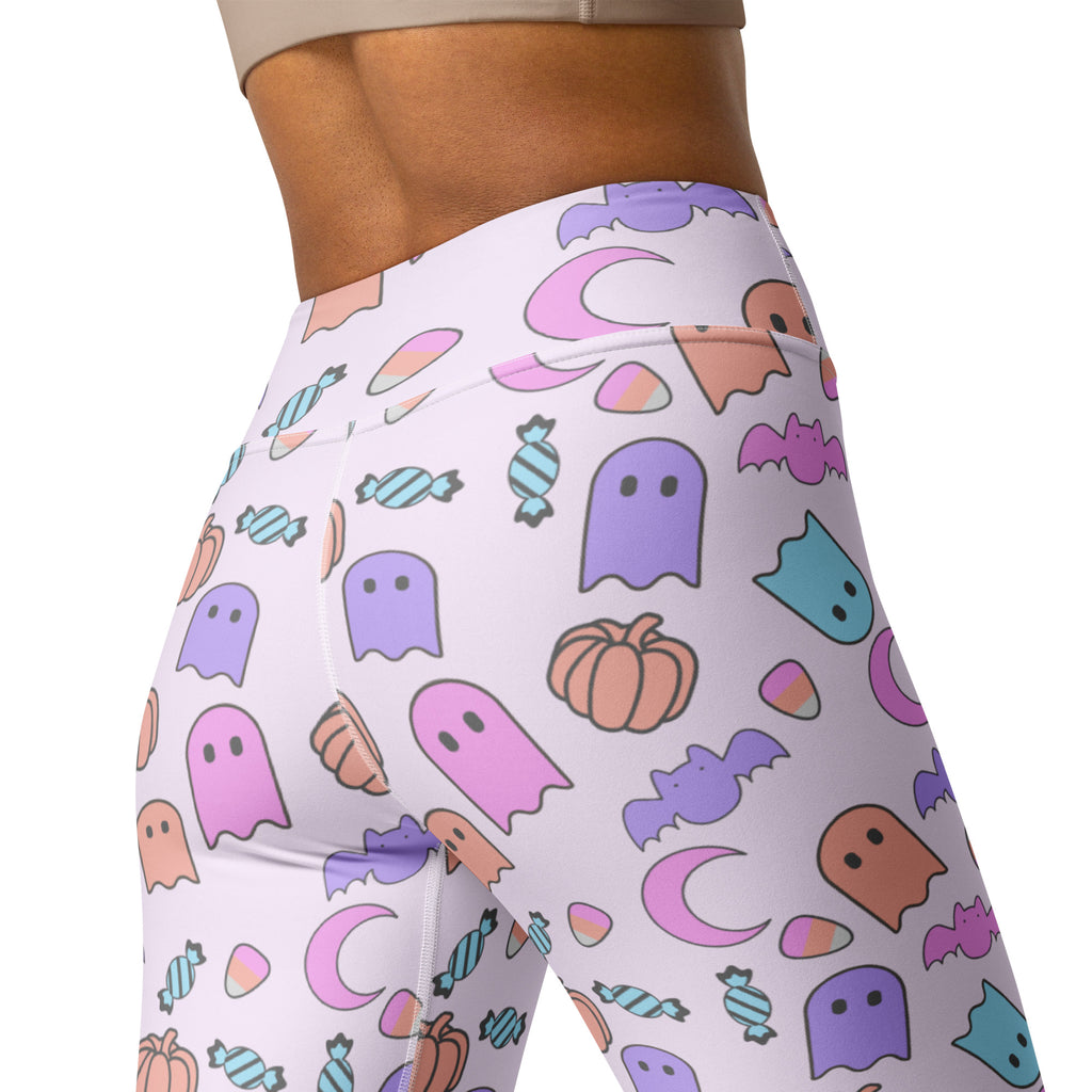 White high waisted buttery soft yoga leggings with pastel ghost halloween pattern featuring bats pumpkins and candy