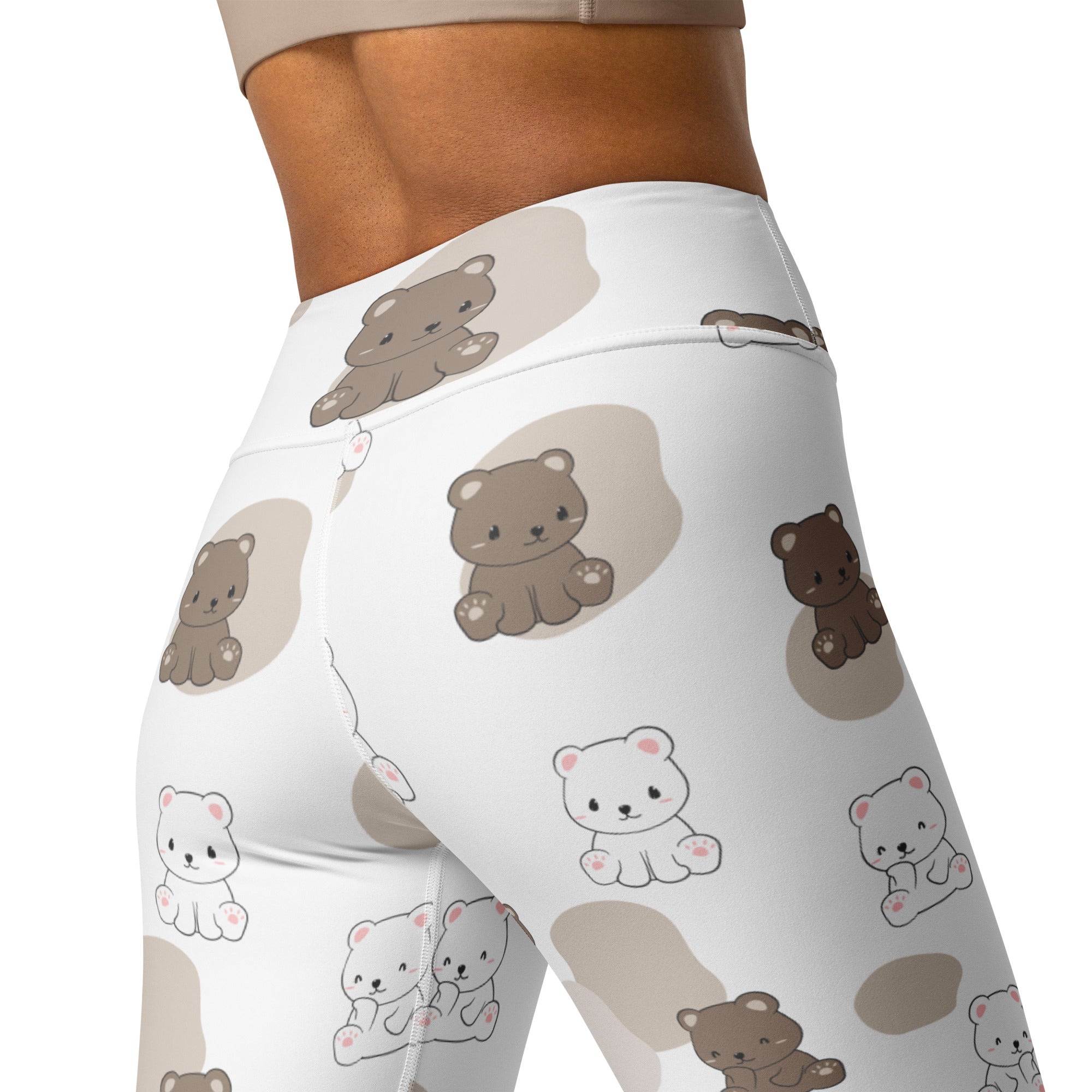 White high-waisted buttery soft yoga leggings with playful brown and white teddy bear pattern on beige circles