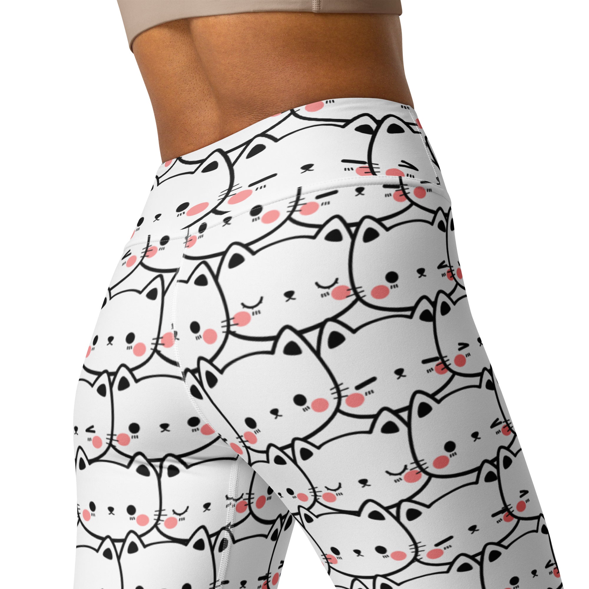 White women’s buttery soft yoga leggings with a playful black-outlined cartoon cat pattern and pink blush cheeks