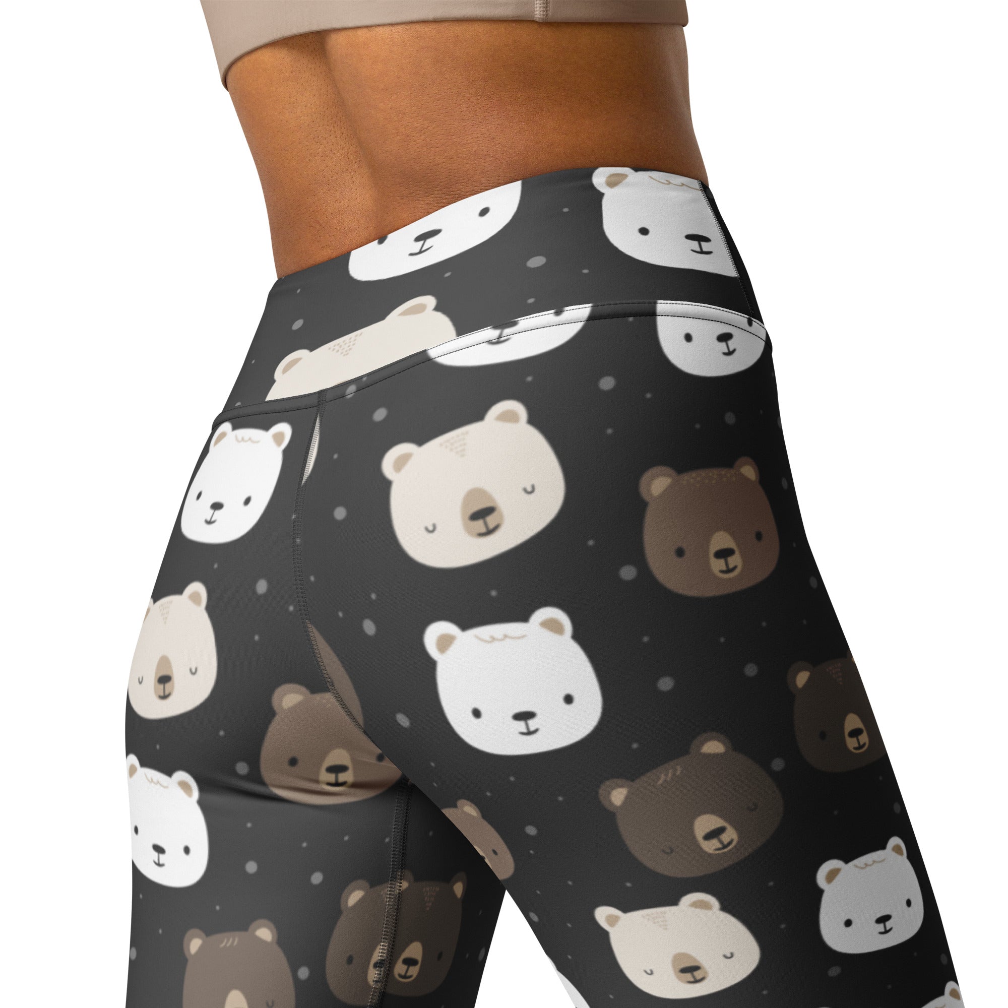 Black high-waisted buttery soft yoga leggings with a playful white and brown cartoon bear face pattern for women
