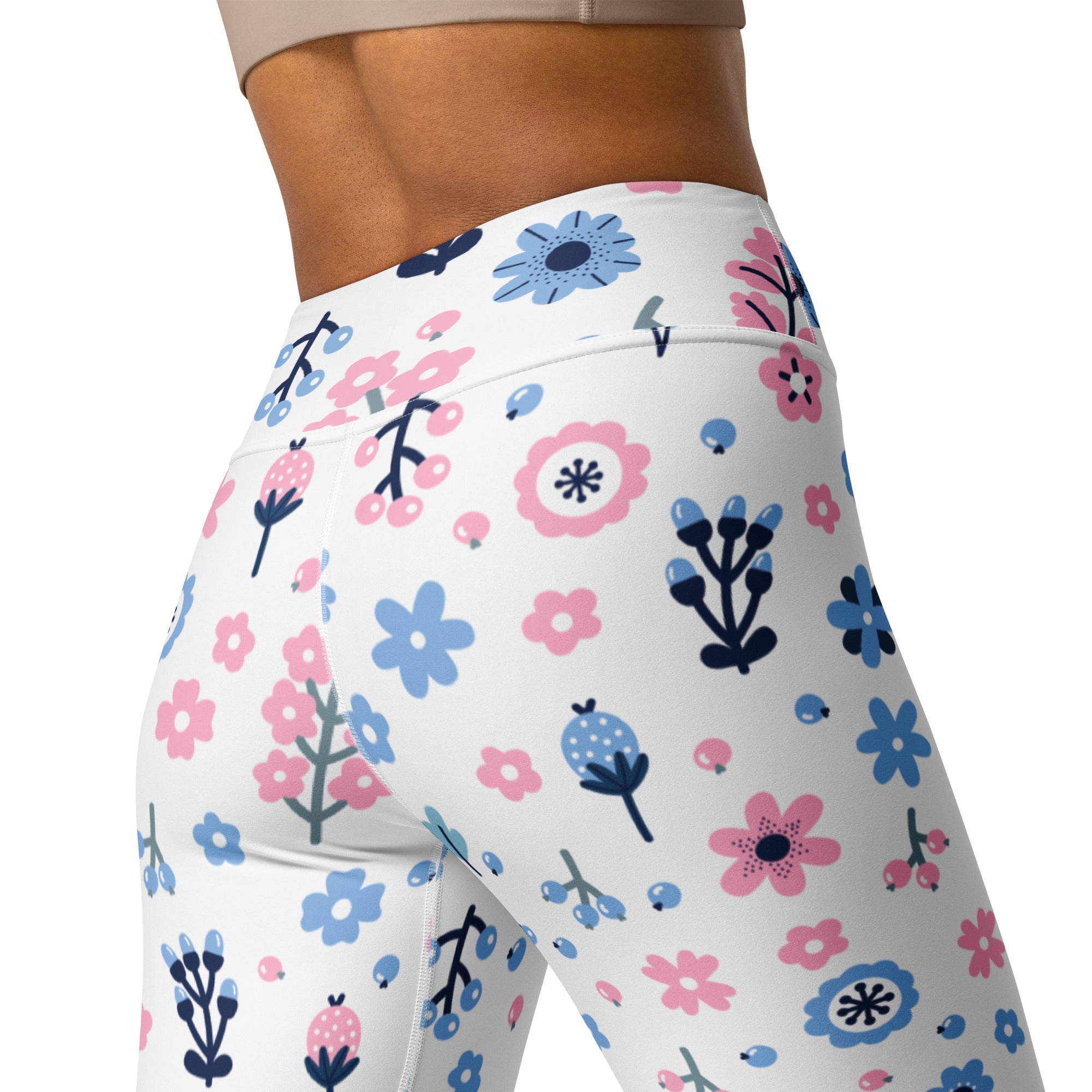 White high-waisted buttery soft yoga leggings with pink and blue cartoon flowers and black stems for women