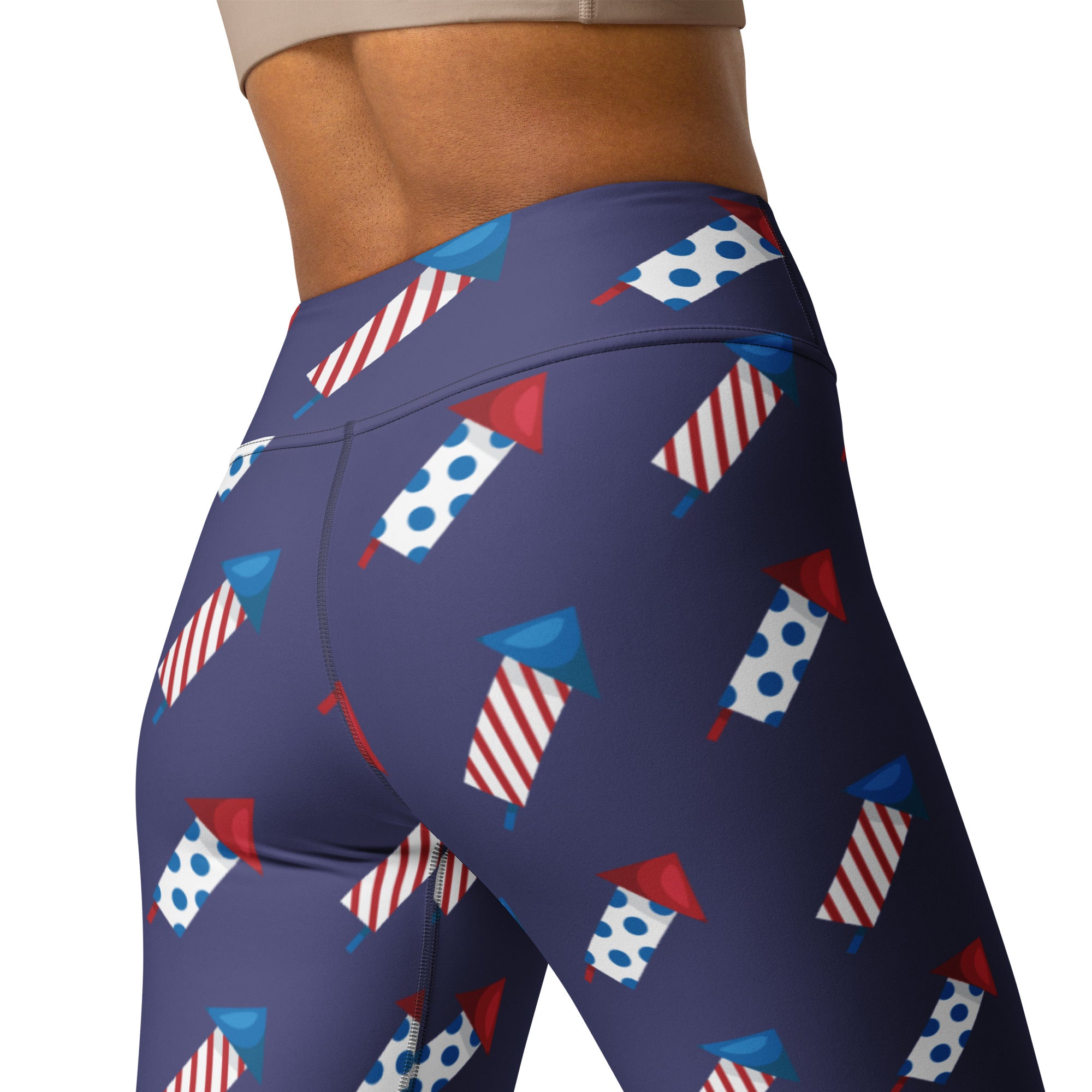 Navy blue high-waisted buttery soft yoga leggings with red white and blue firework rocket pattern for women