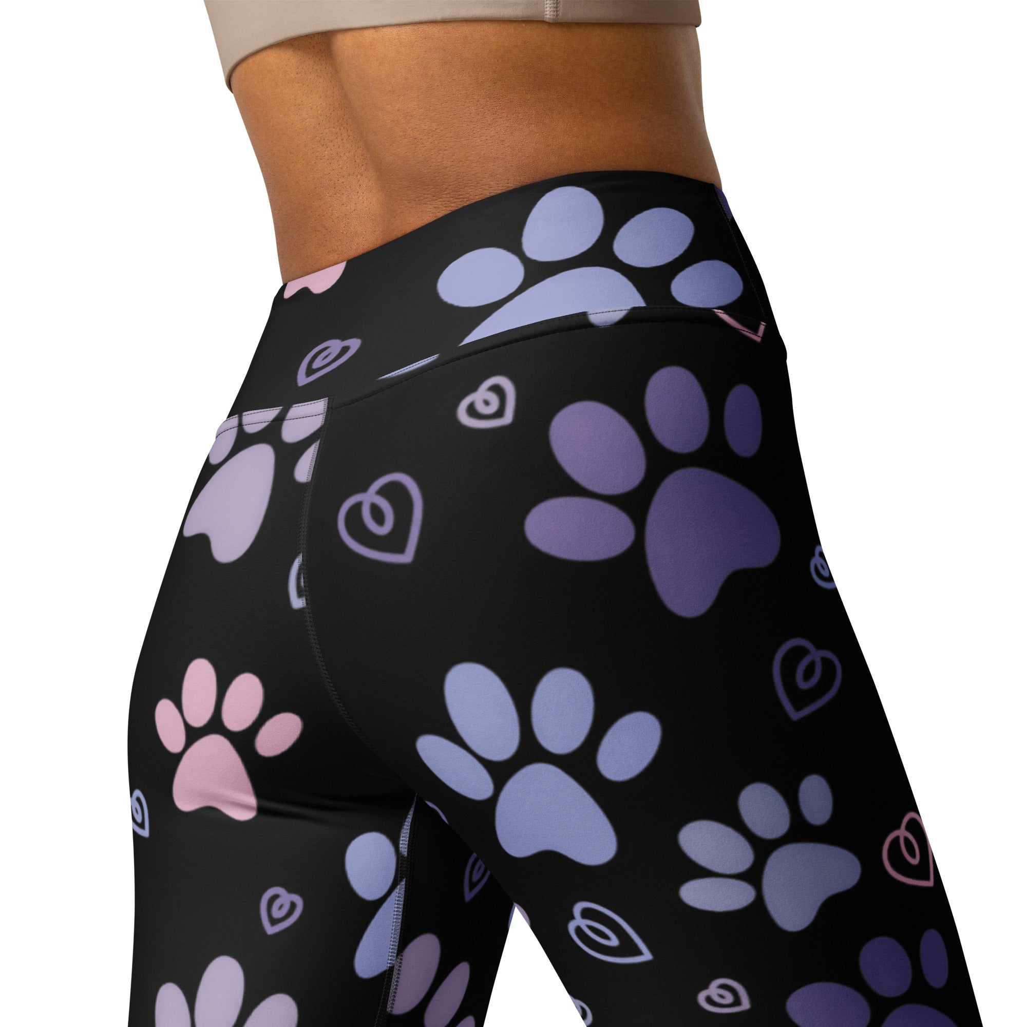 Black high-waisted buttery soft yoga leggings with pastel purple blue and pink paw prints and outlined hearts design