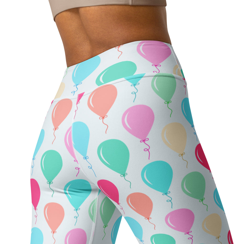 White buttery soft yoga leggings with colorful birthday balloons pattern in pink teal green and peach